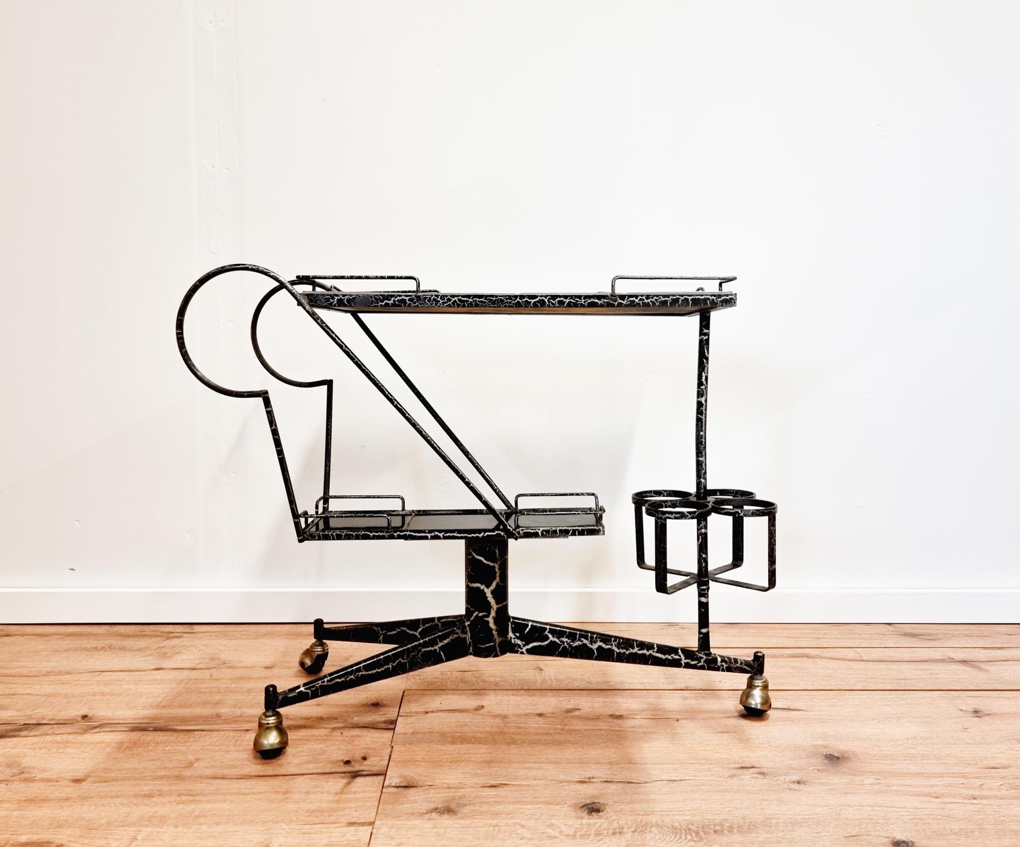 Rare midcentury bar cart in black lacquered steel, tile tops and brass wheel covers. France, mid1900s. 

One tile with smaller dent, signs of age and use. Lacquere with natural decorative cracks.

