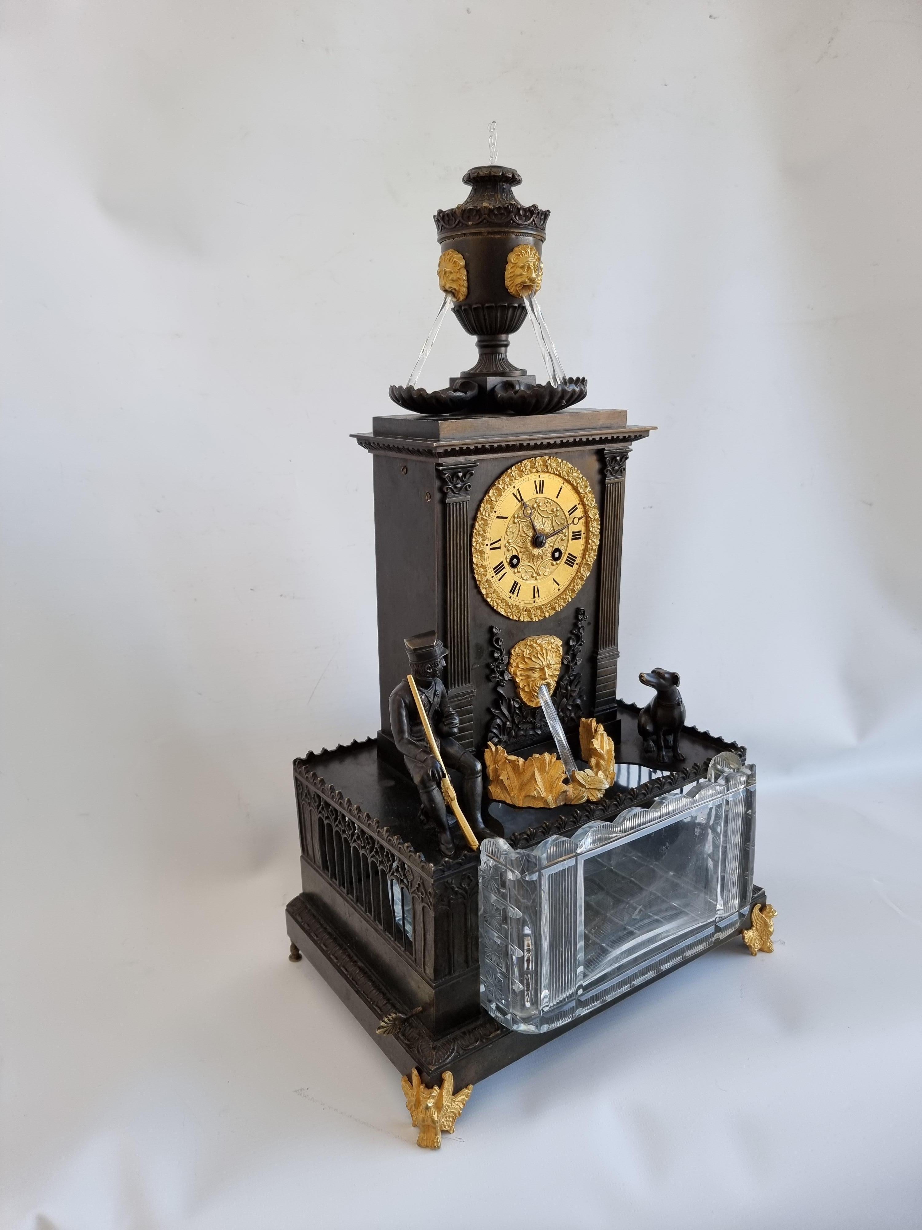 A very rare French patinated bronze and original ormolu Charles X automaton clock. The automatons working from a separate movement in the base working five water features. The two train 8 day movement striking the hours on the halfs and hours on the