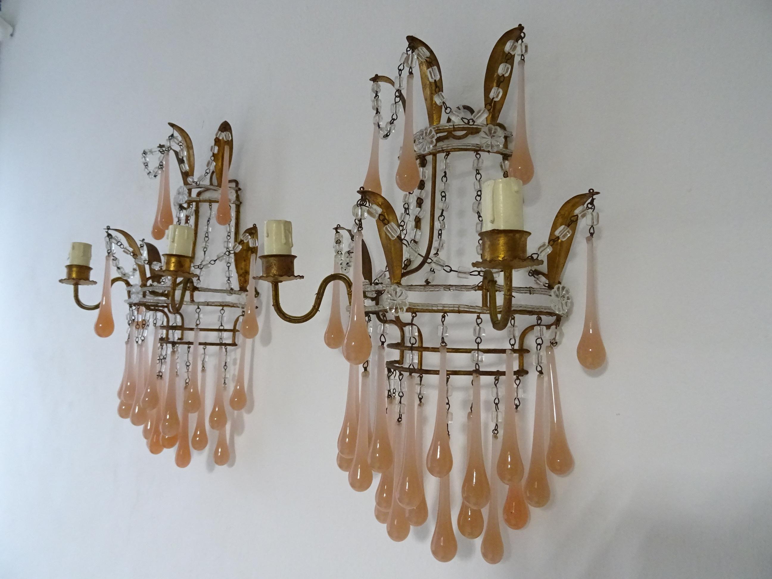These sconces will be rewired with certified UL US sockets for the USA and appropriate sockets for the rest of the World. Extremely rare sconces housing 2 lights each. Beaded with florets and macaroni beads. Adorning peach pink Murano opaline drops,