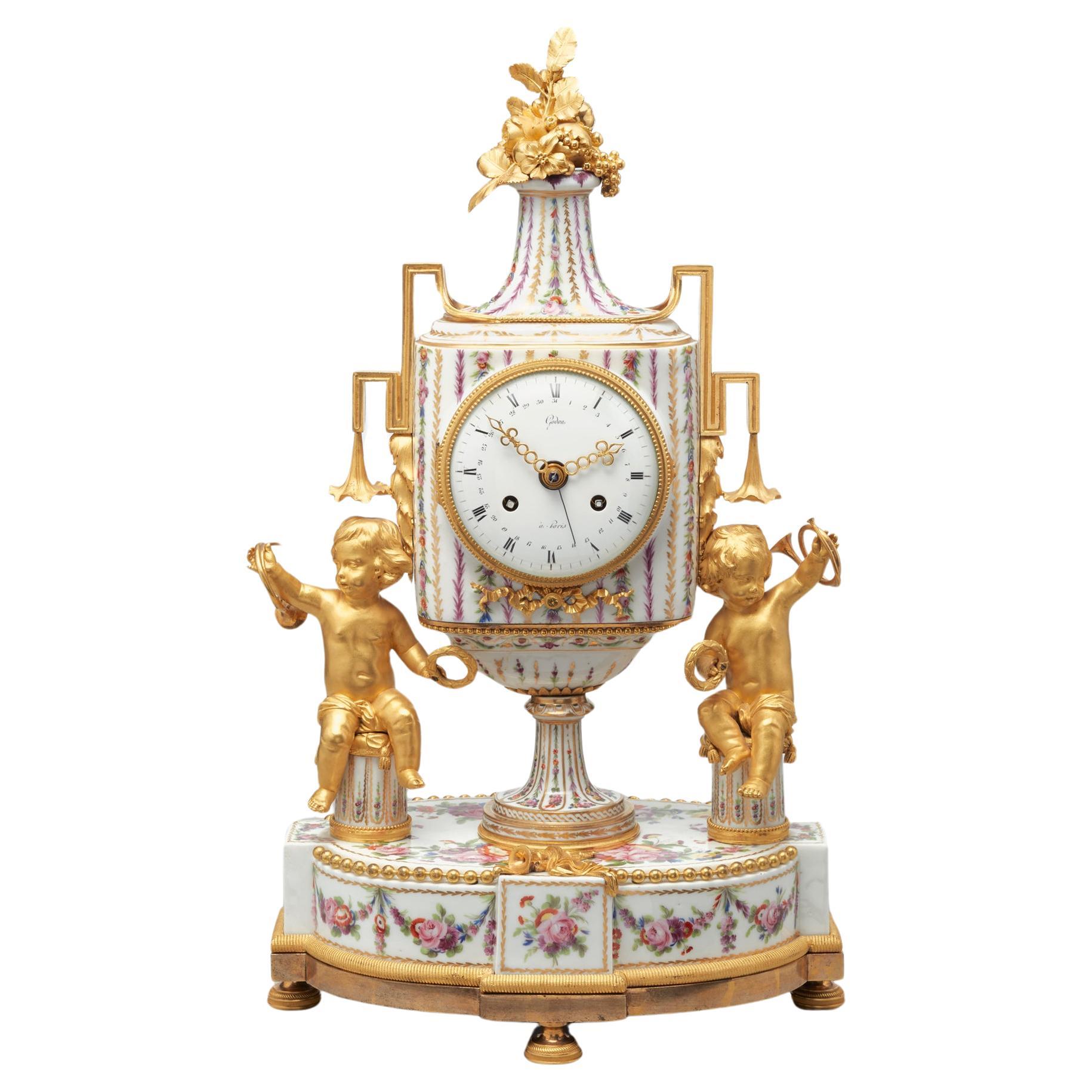 Rare French porcelain and gilt bronze mantel clock by Godon For Sale