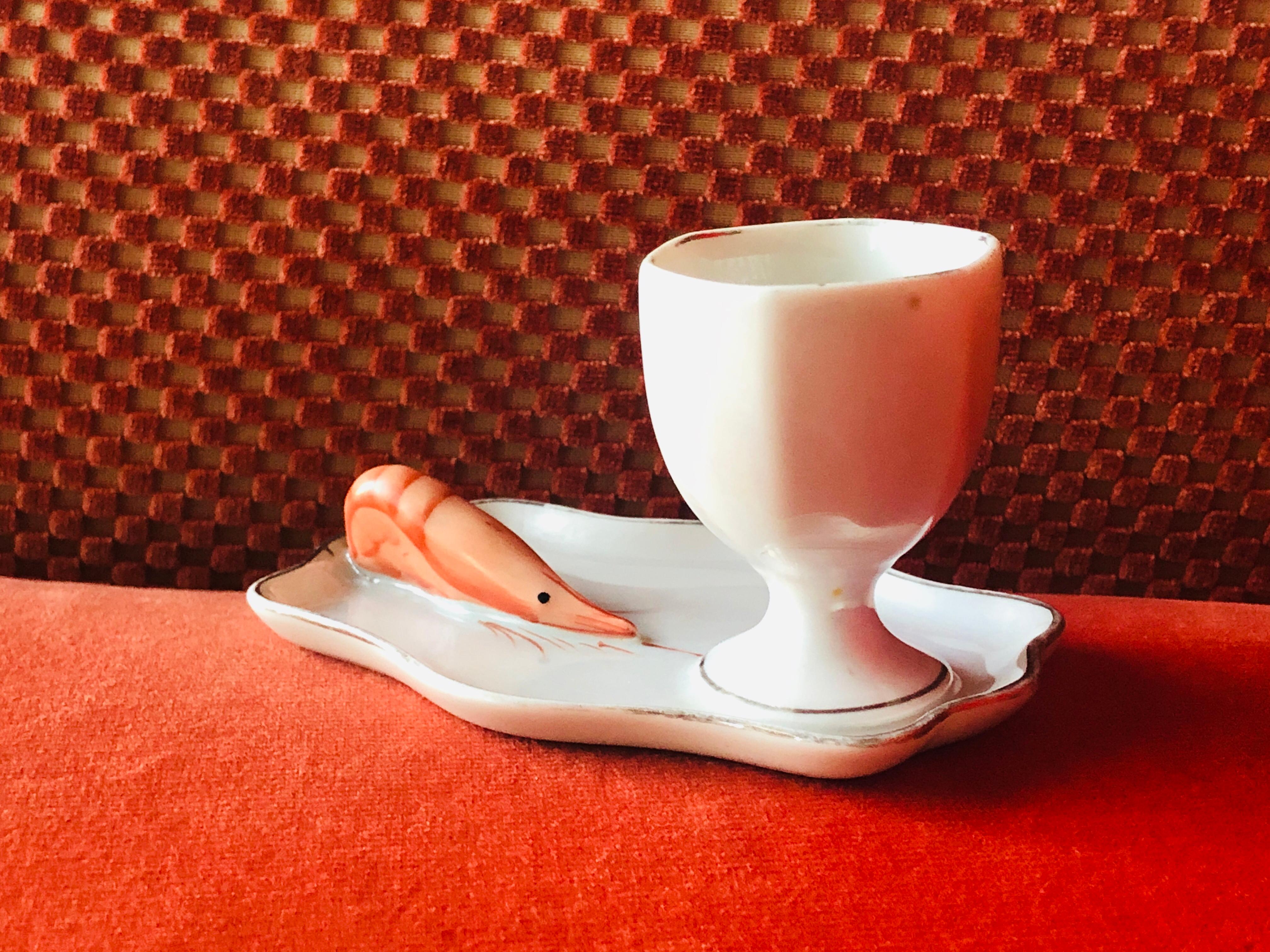 Porcelain egg cup with a shrimp aside by Dadat Limoge.
France, circa 1880.
