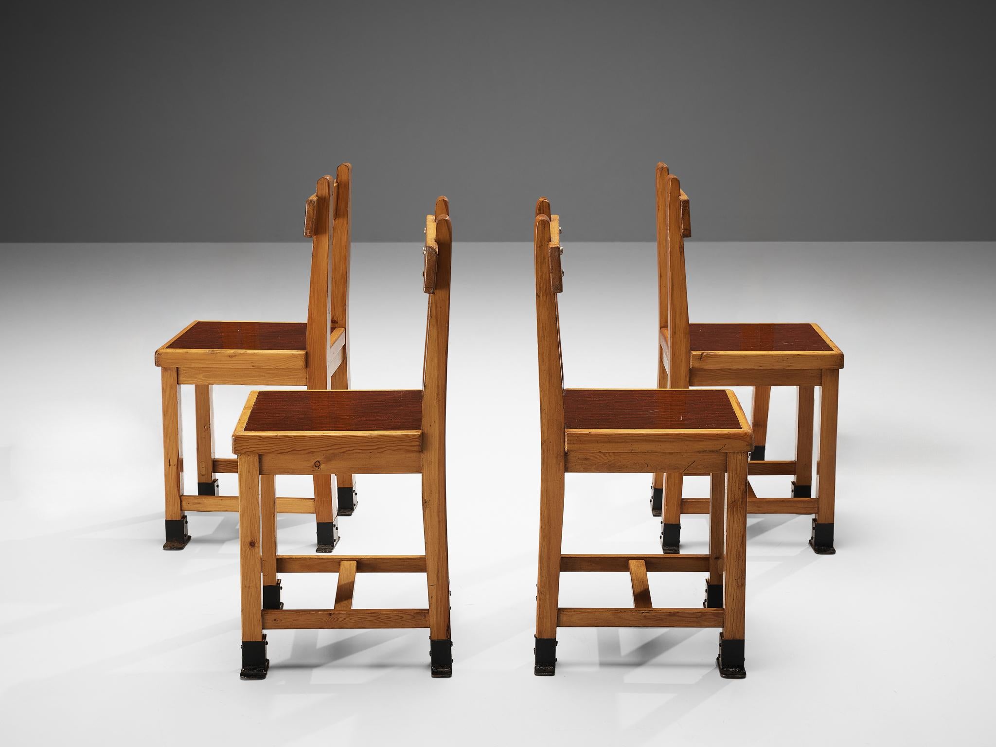 Set of four dining chairs, pine, metal, France, 1940s

This set of French dining chairs features a rather stunning design. Very strong and clean lines structure the chair in an admirable way. Characteristic are the black metal feet that fit within