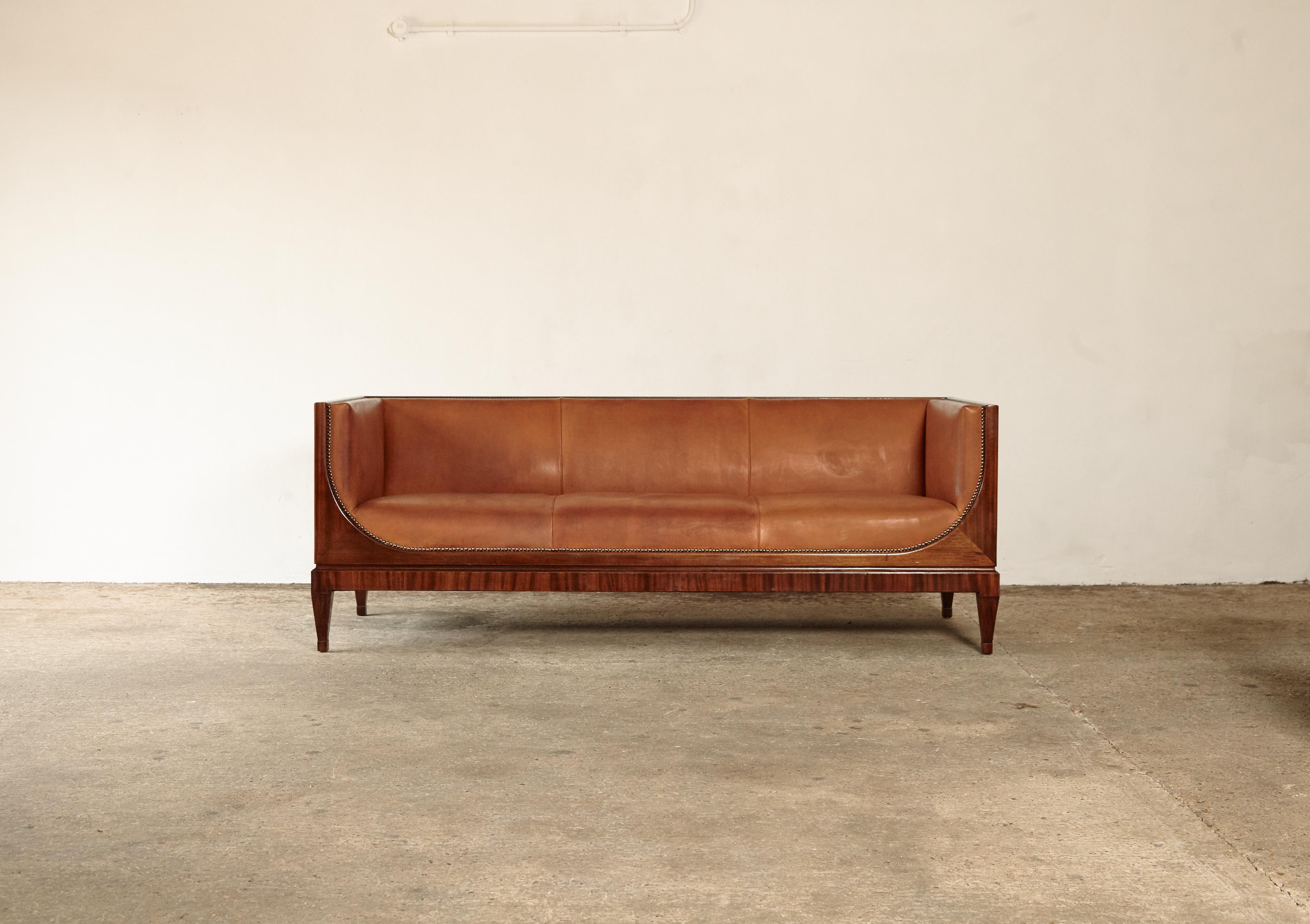 Rare Frits Henningsen box sofa, Denmark, 1940s-1950s. Designed and produced by Frits Henningsen, Copenhagen. Mahogany frame and later leather upholstery. In very good vintage condition with minor signs of use and wear relative to age. 

  