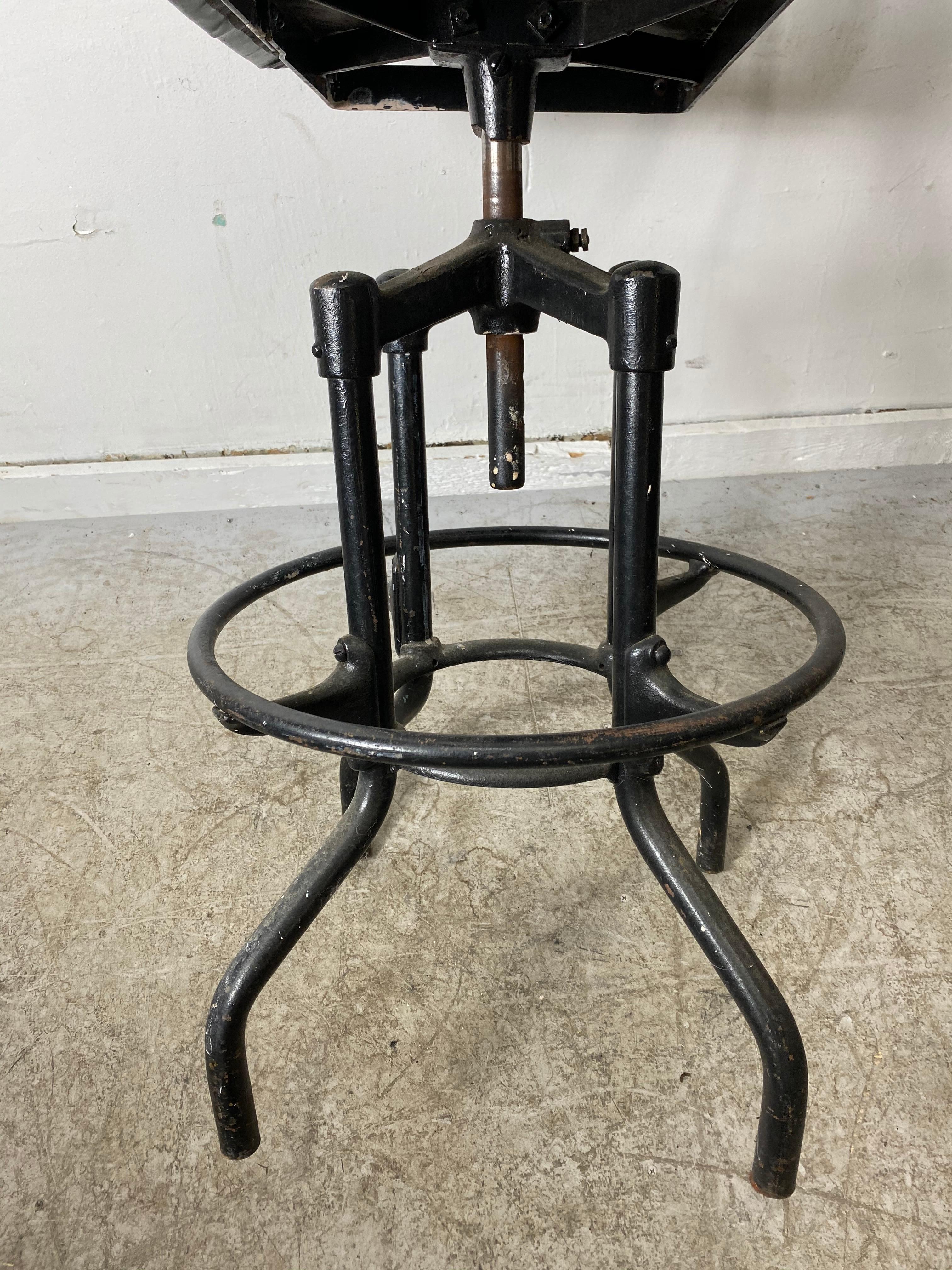 Rare Fritz Cross modernist Industrial stool, 1930s retains original upholstery. Stunning unusual design.