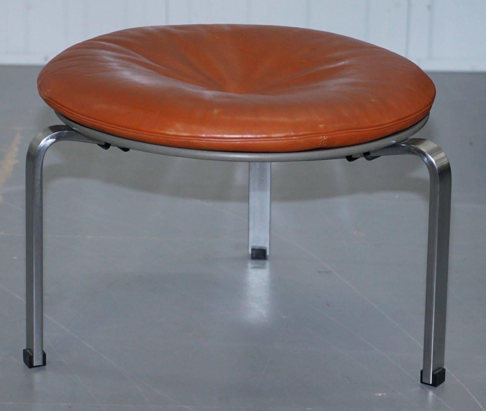 We are delighted to offer for sale this very rare original fully stamped and engraved Poul Kjaerholm PK-33 brown leather stool retailed by Fritz Hansen in 1983

A simply exquisite model, very rare to find with the original factory sticker on as