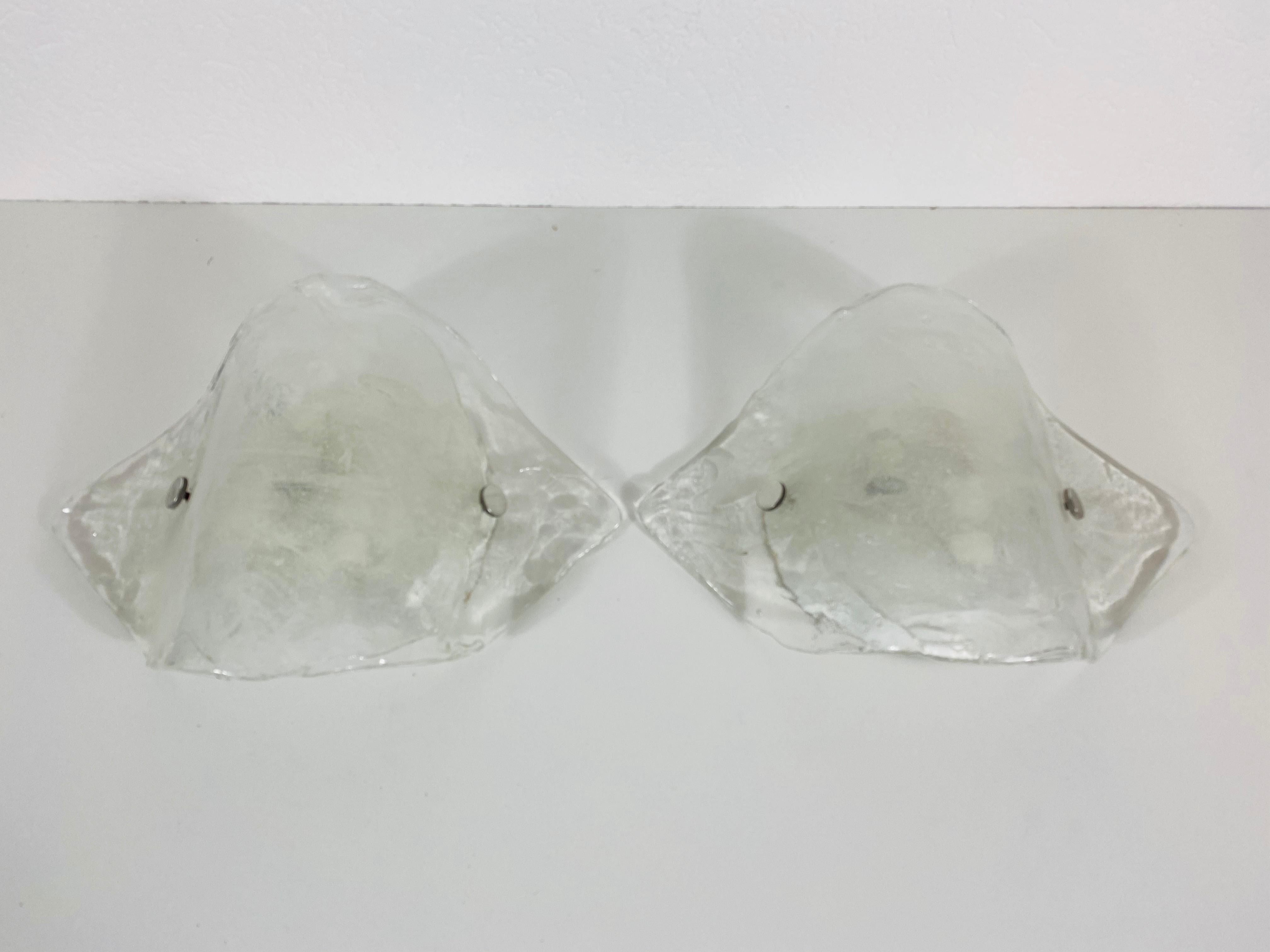 Amazing wall lamps by the Austrian brand Kalmar Franken made in the 1960s. Frosted ice glasses secure to the aluminum frame. Designed by Italian Designer Carlo Nason.

The light requires two E14 light bulbs. Very good vintage condition.

Free