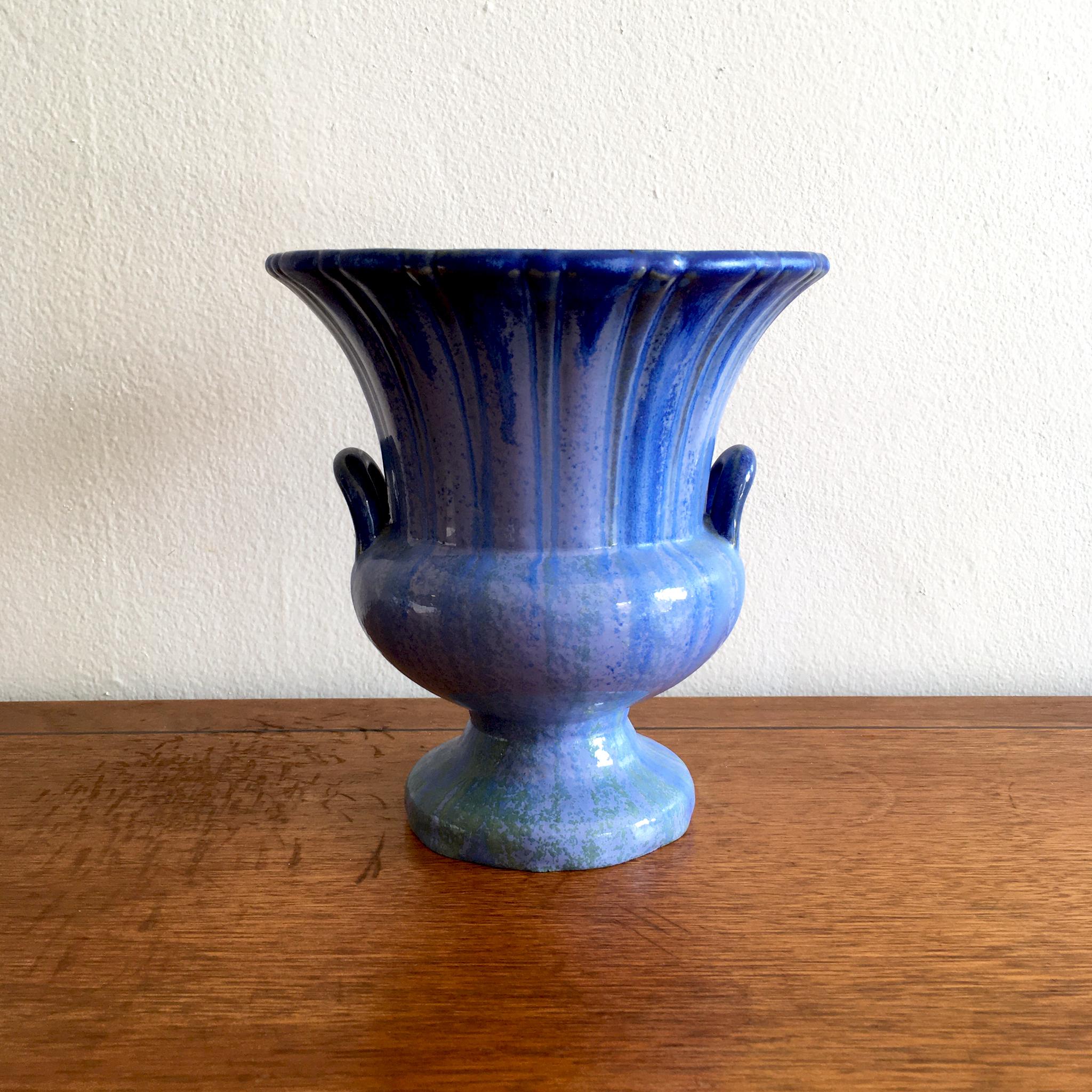 Rare Fulper Pottery handled vase/ urn, shape 4018, with stunning blue drip glaze. At seven inches tall and seven inches in diameter, this make an impact wherever it is placed. This piece looks wonderful on its own, or paired with a group. Signed,