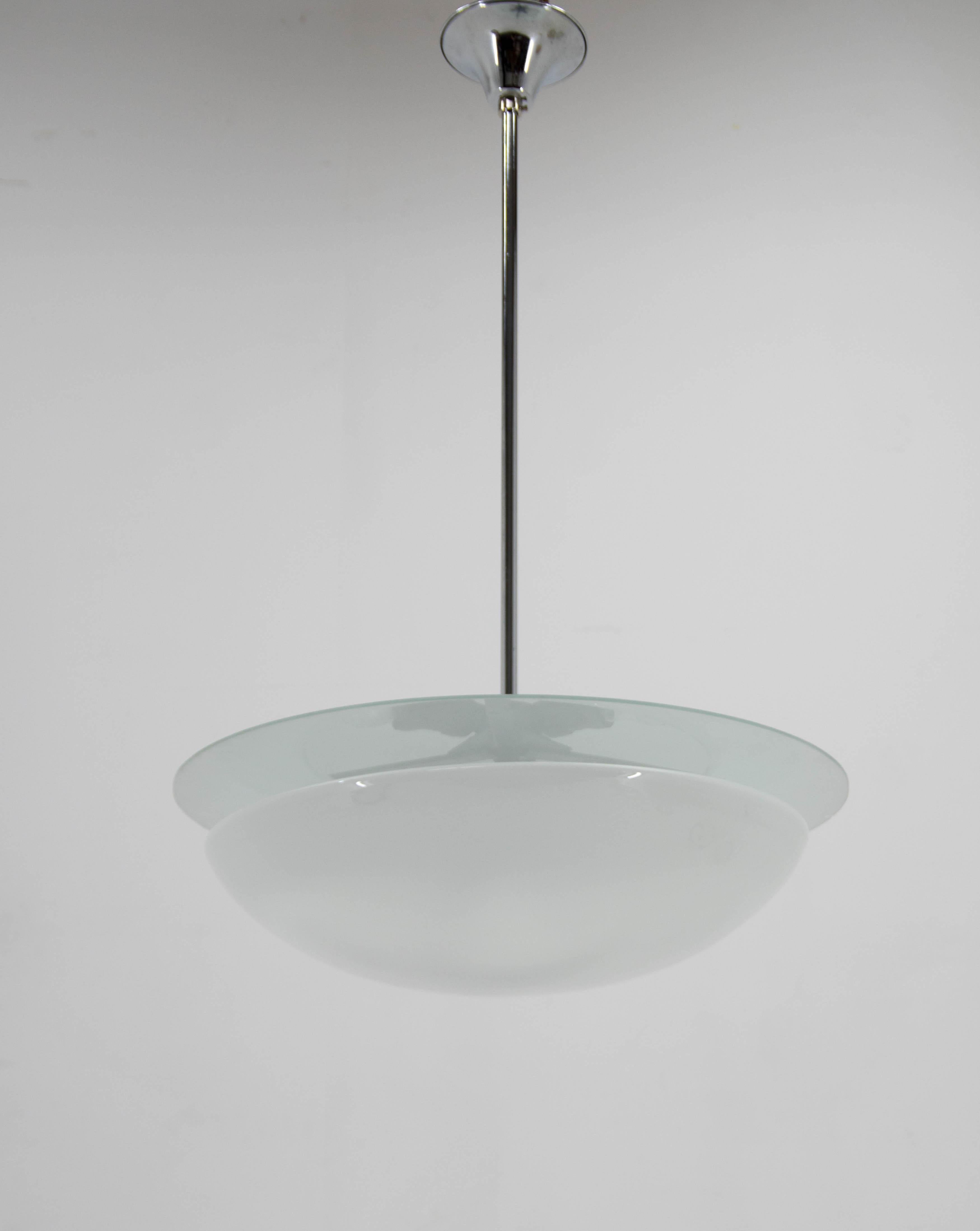Very rare functionalist / Bauhaus chandelier made and labeled by DRUKOV in Czechoslovakia in 1930s-1940s
Simple and elegant design.
Bottom opaline glass bowl, upper sand blasted flat glass.
Cleaned, rewired: 3x60W, E25-E27 bulbs
US wiring compatible