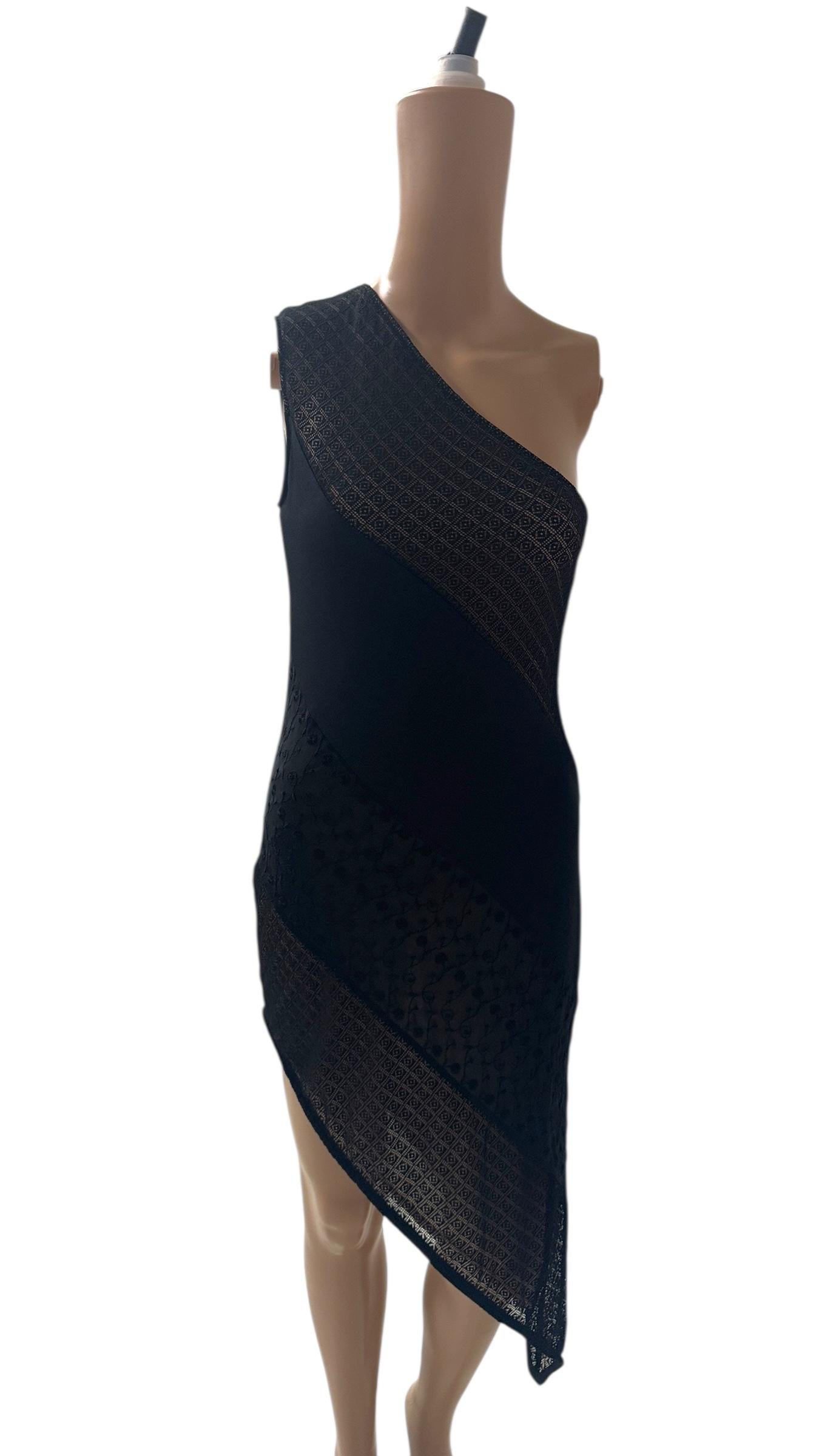 A stunning and rare black one-shoulder dress by Future Ozbek, designed in the 1990s as part of the youthful diffusion line of Rifat Ozbek. Future Ozbek represents the younger, more playful side of the brand, offering bold, fashion-forward pieces