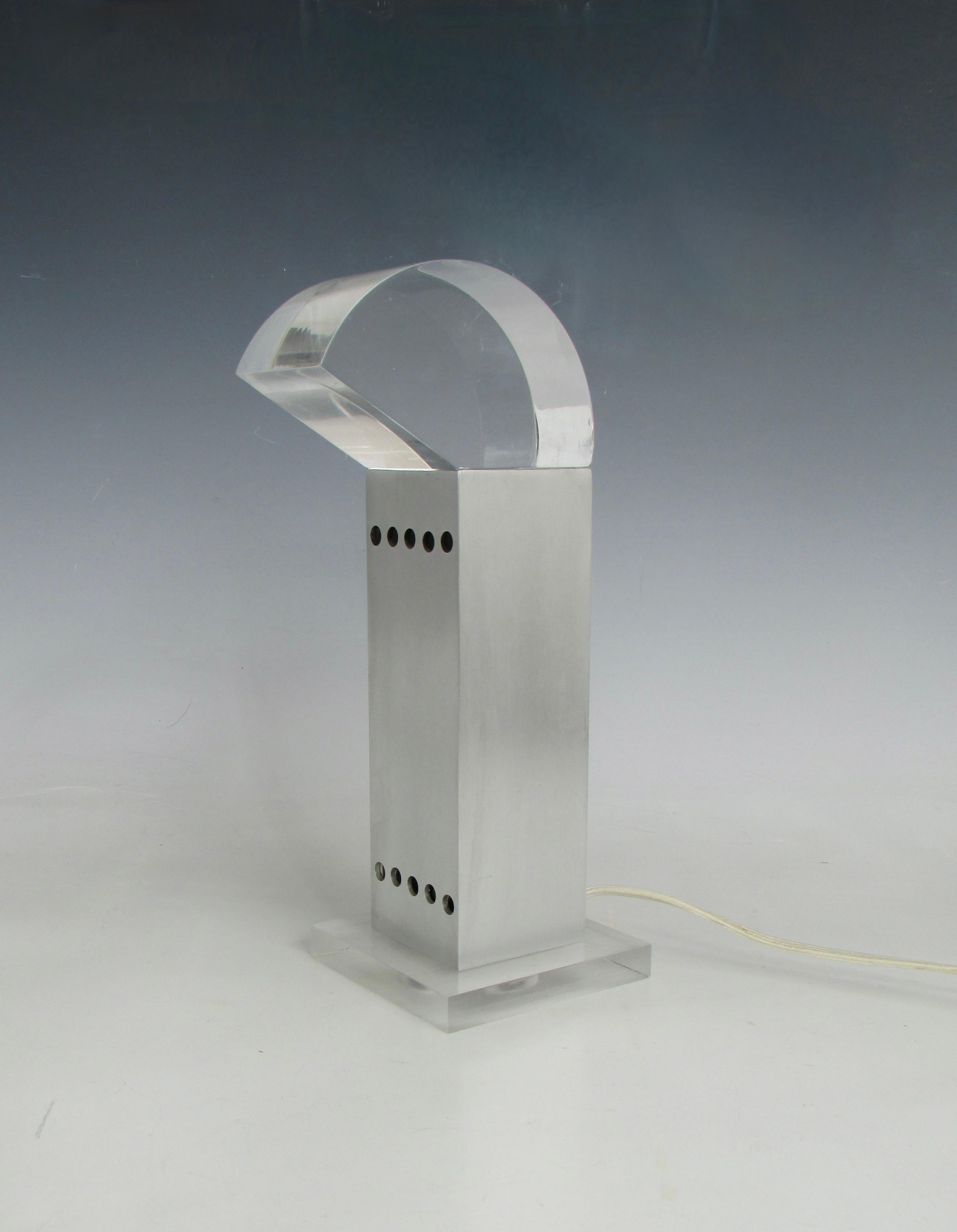 Rare small table lamp designed by Gaetano Missaglia . Polished  Lucite diffuser sits in square aluminum tube atop frosted Acrylic base . 