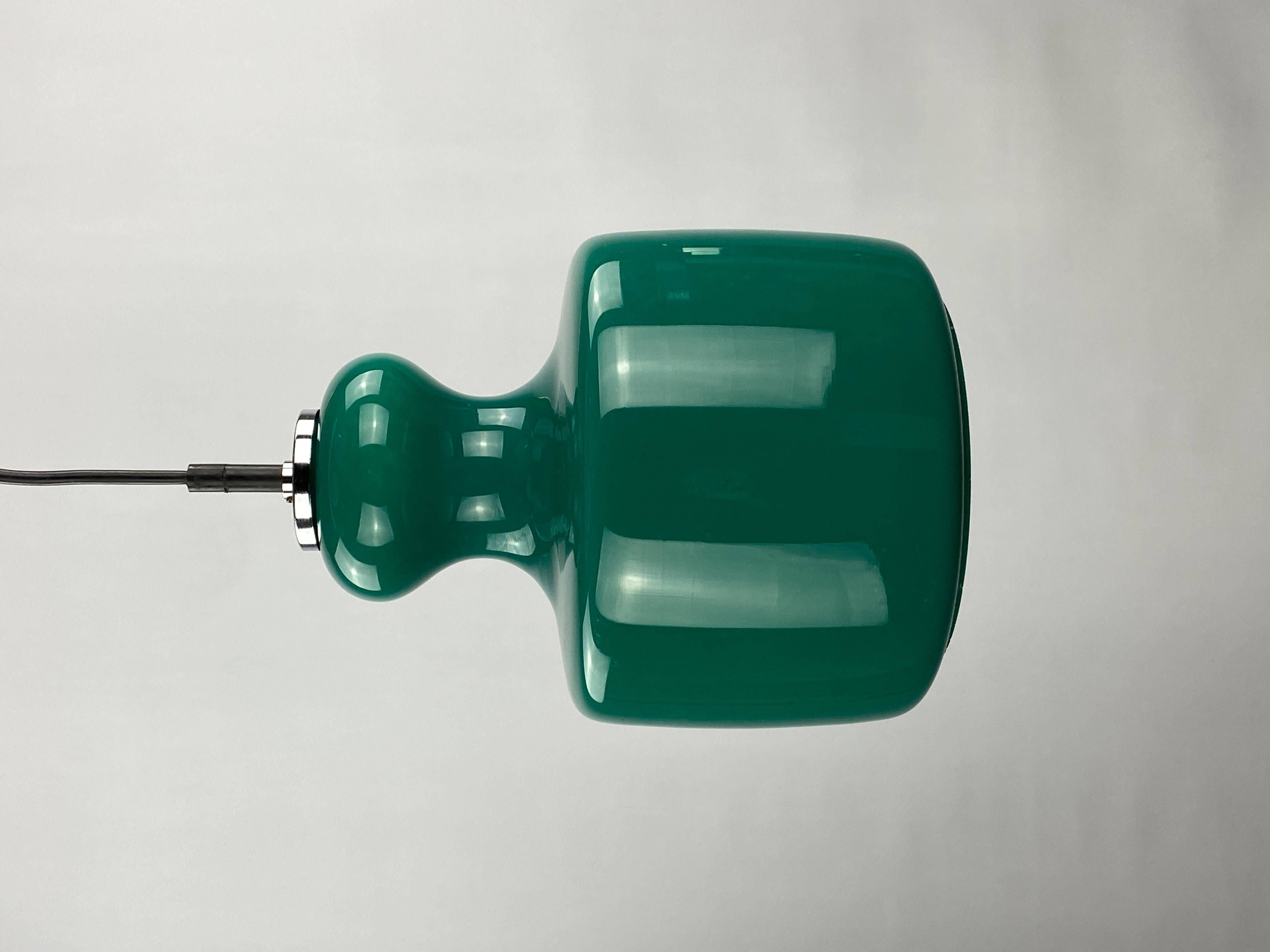 What - a - find! This rare galaxy green pendant light is made by the German company Peill and Putzler around 1960. The galaxy series are already extremely rare, but this time we were able to get hold of a fantastic model in the green galaxy