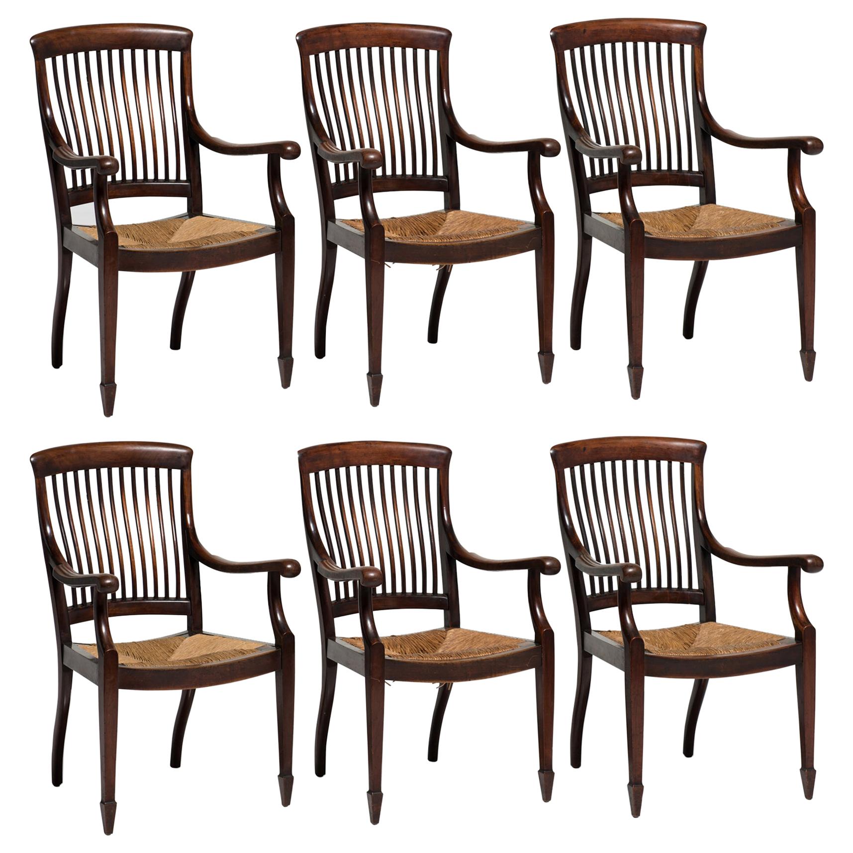 Rare gentleman’s club armchairs, England, 19th century.

Made in solid walnut with original rush seats and makers label.