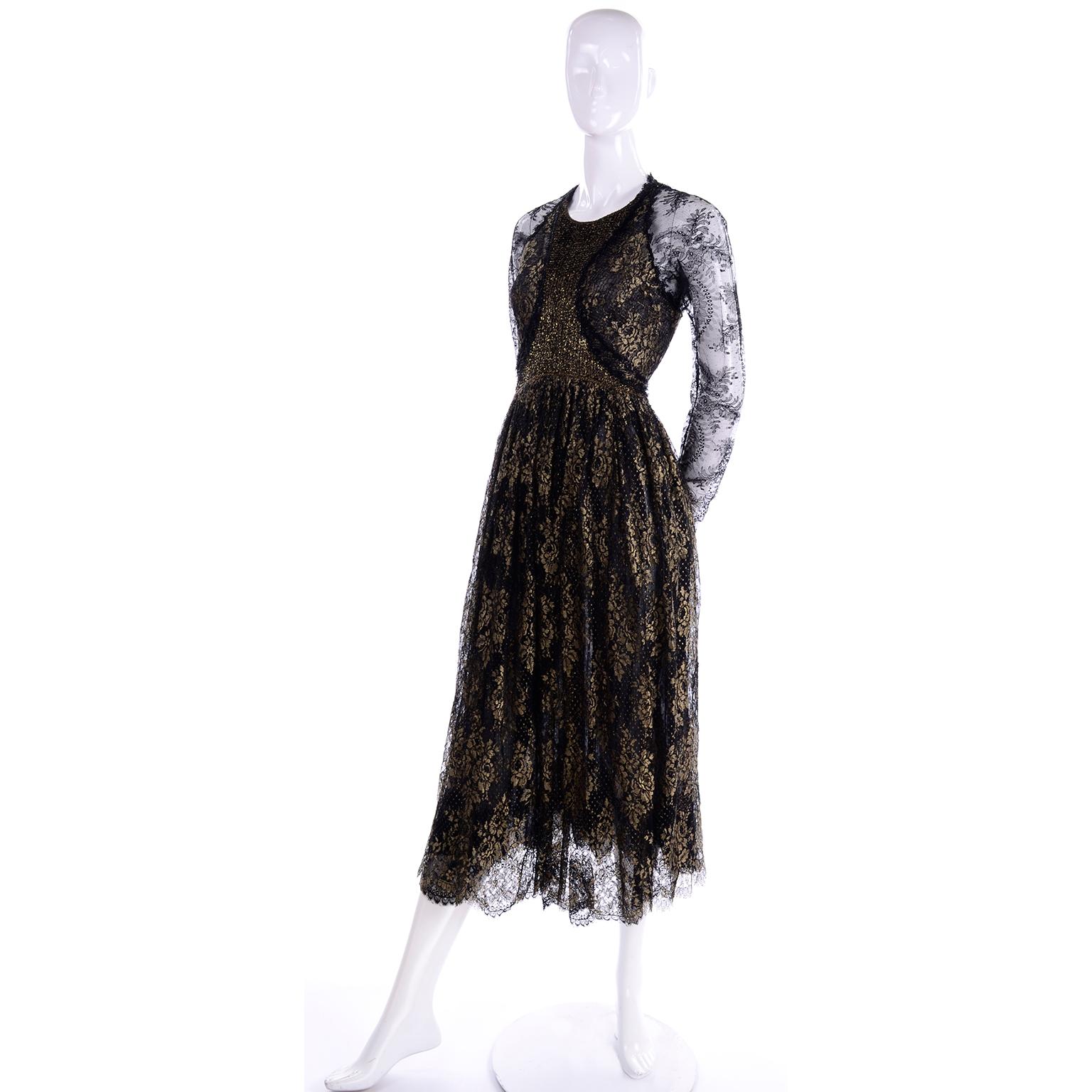 This is an outstanding early 1990's vintage Geoffrey Beene sheer black and gold metallic lace dress with a layered lace skirt. This rare dress is in a gorgeous black lace woven with gold metallic flowers, and the hemline is scalloped. This dress is