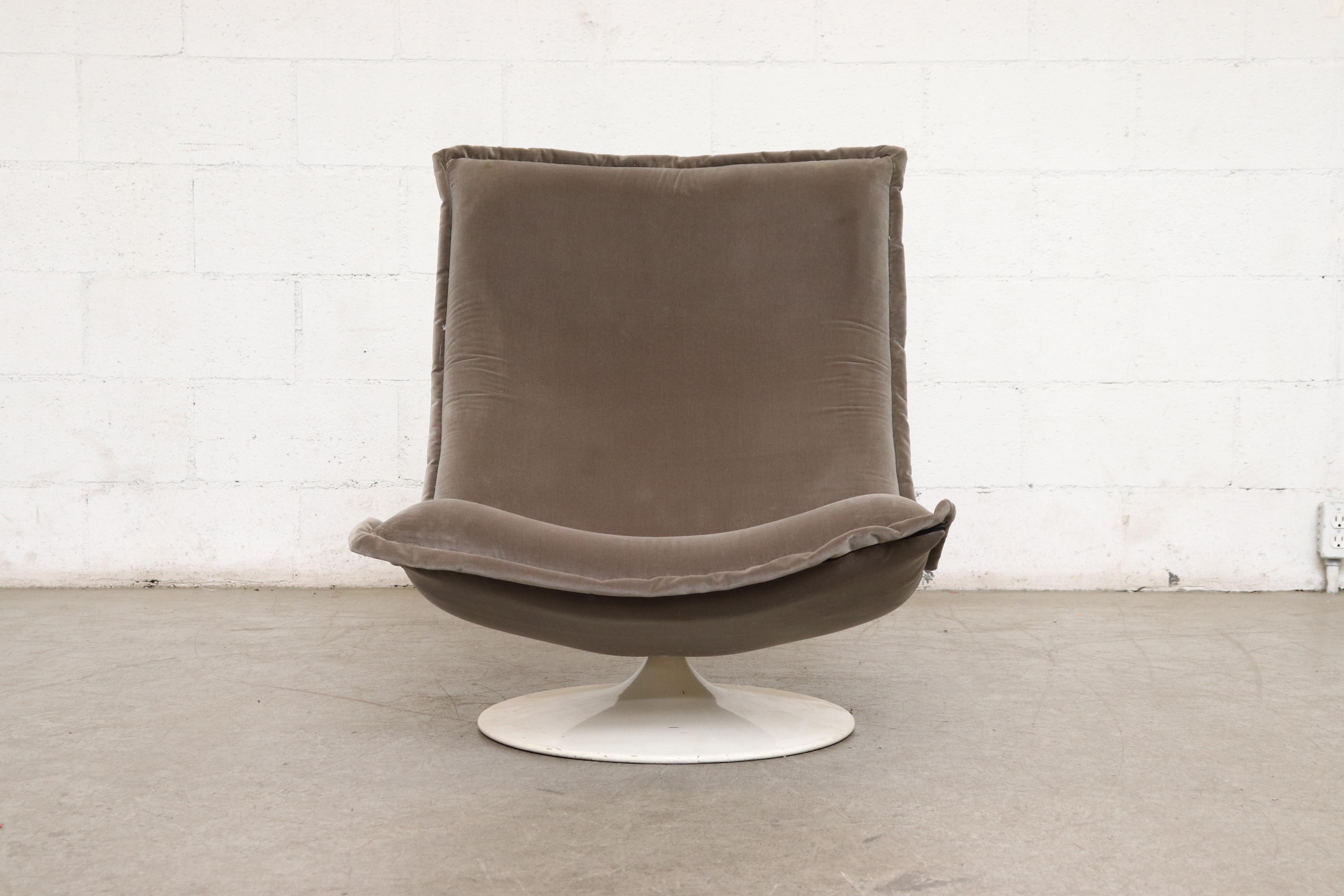 Rare midcentury armless swivel lounge chair by Geoffrey Harcourt with Saarinen inspired base. Newly upholstered in seal grey velvet. Slight wear and scratching to base, consistent with age and use. Good original condition.