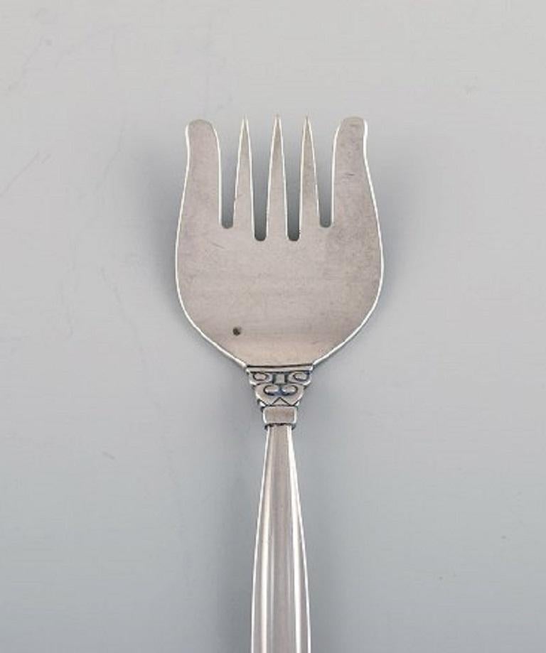 Rare Georg Jensen Acorn five-pronged fork in sterling silver.
Measures: Length 14.5 cm.
Stamped.
In excellent condition.
Our skilled Georg Jensen silversmith / jeweler can polish all silver and gold so that it appears as new. The price is very