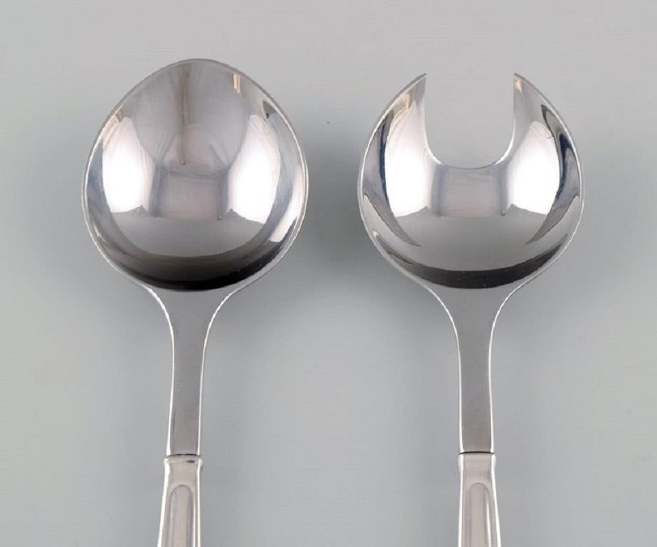 Rare Georg Jensen Koppel cutlery. Salad set in sterling silver and stainless steel.
Measure: Length: 22 cm.
In excellent condition.
Stamped.
Designed by Henning Koppel in 1981.
Our skilled Georg Jensen silversmith / goldsmith can polish all