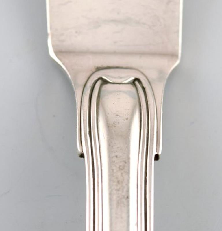 Rare Georg Jensen Old Danish fish knife in sterling silver. Ten pieces in stock.
In very good condition.
Measures: 20.5 cm.
Stamped.
 