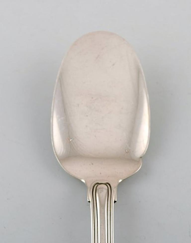 Rare Georg Jensen Old Danish ice cream spoon in sterling silver. Three pieces in stock.
In very good condition.
Measures: 17.5 cm.
Stamped.
Large selection of Georg Jensen Old Danish in stock.