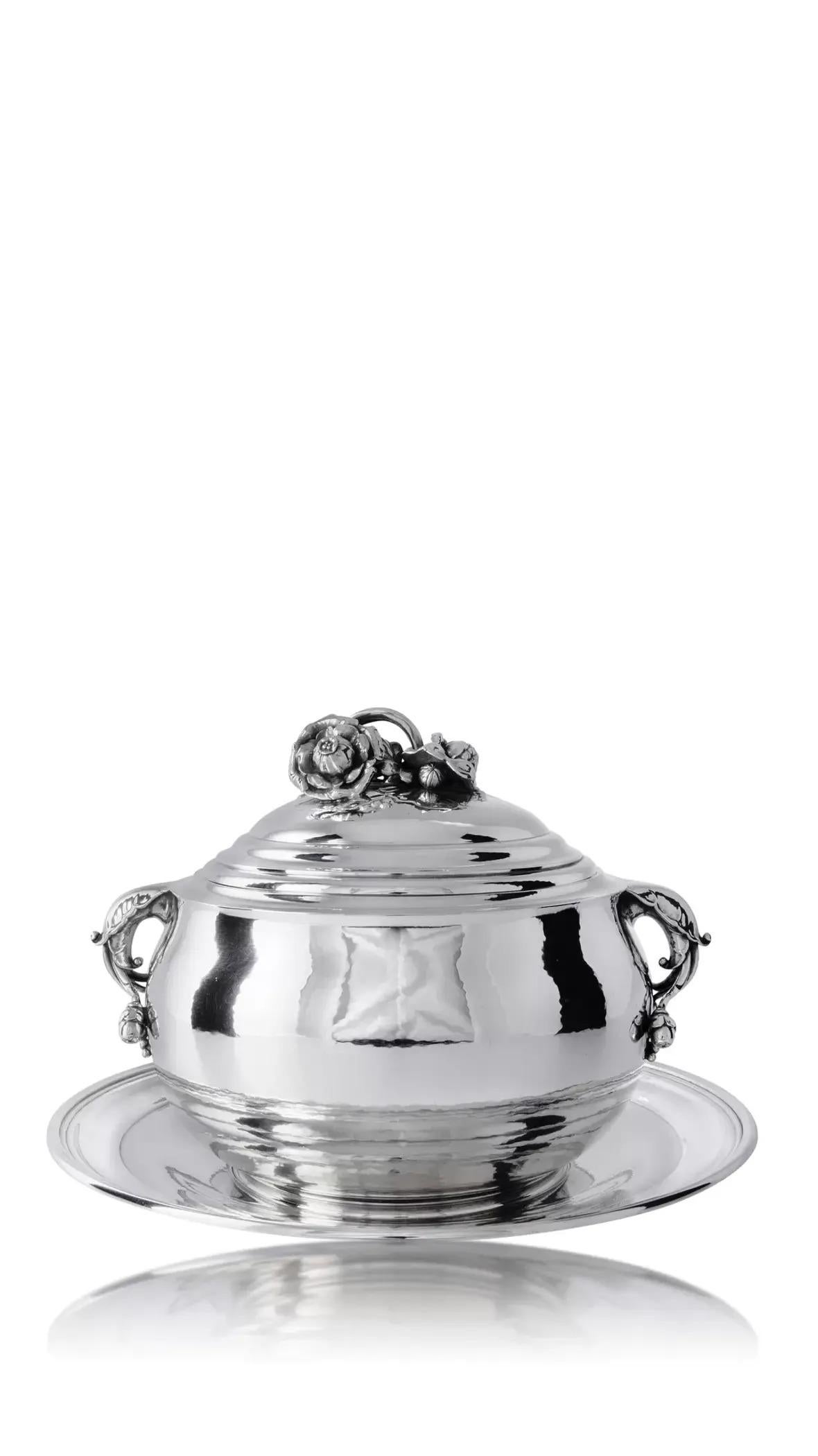 A rare vintage sterling silver Georg Jensen round tureen with amazing floral decorations and underplate, design #337C by Georg Jensen from circa 1920. A circular tureen with two leaf capped handles with berry joins, the domed cover with floral and
