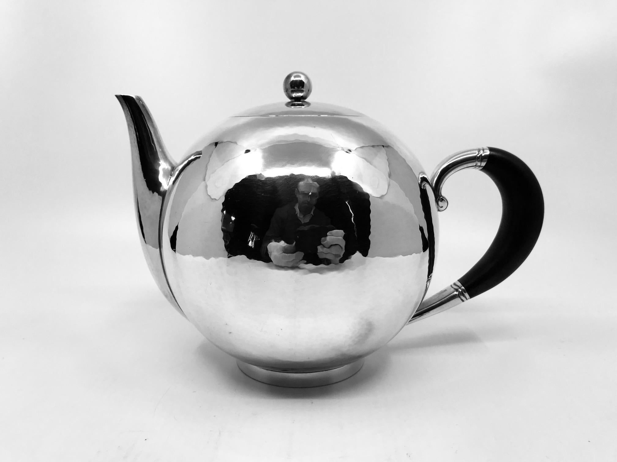 This is a very rare sterling silver Georg Jensen Art Deco teapot with ebony handle, the larger size design #533B by Johan Rohde from circa 1930. This is Rohde design at its very best, see the way the lid of the teapot sits flush with the pot,