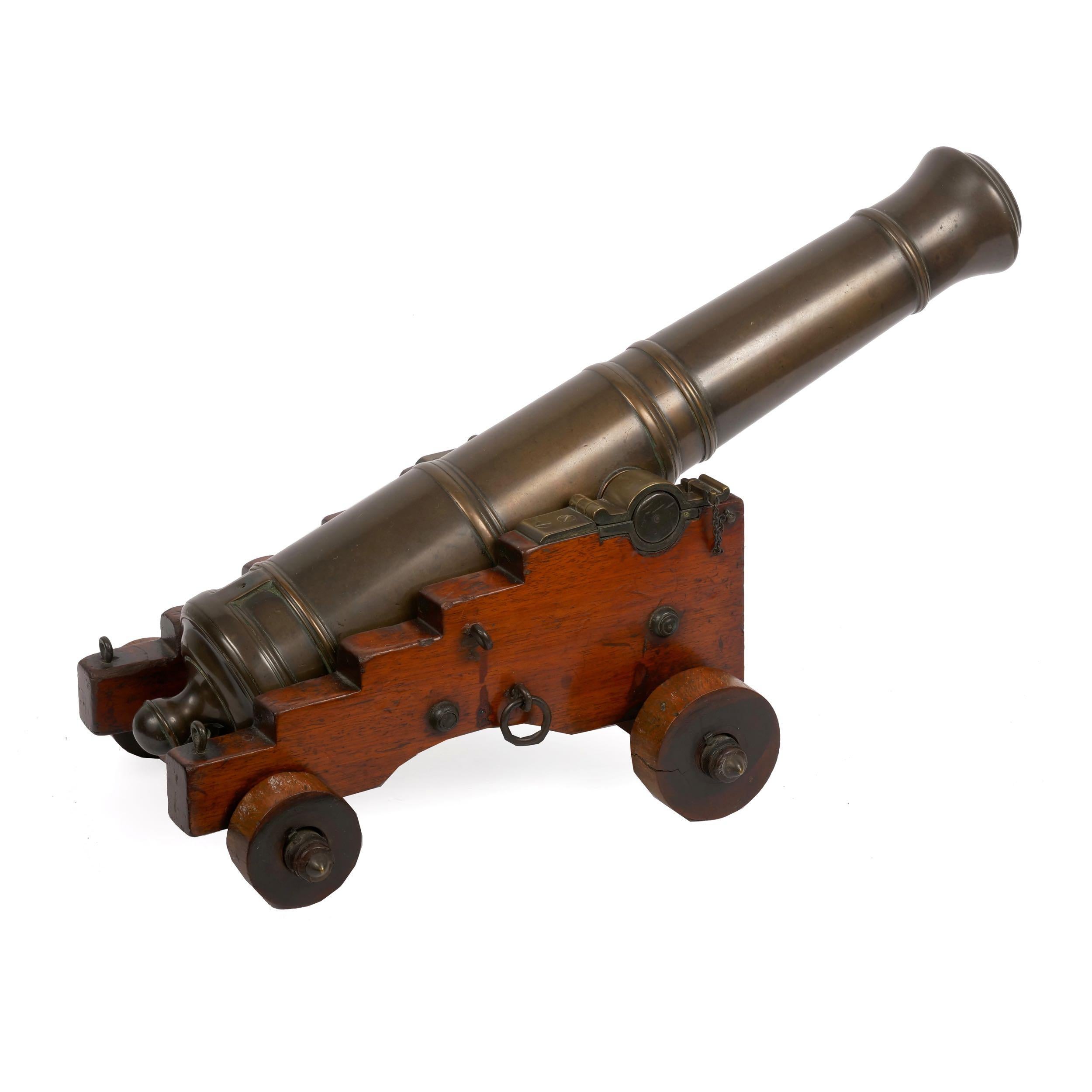 GEORGE III BRONZE SIGNAL CANNON ON LIGNUM VITAE CARRIAGE
England, circa first half of 19th century; unmarked
Item # C104014 

A fine and rather large George III cast bronze signal cannon from the first half of the 19th century, the hand-crafted
