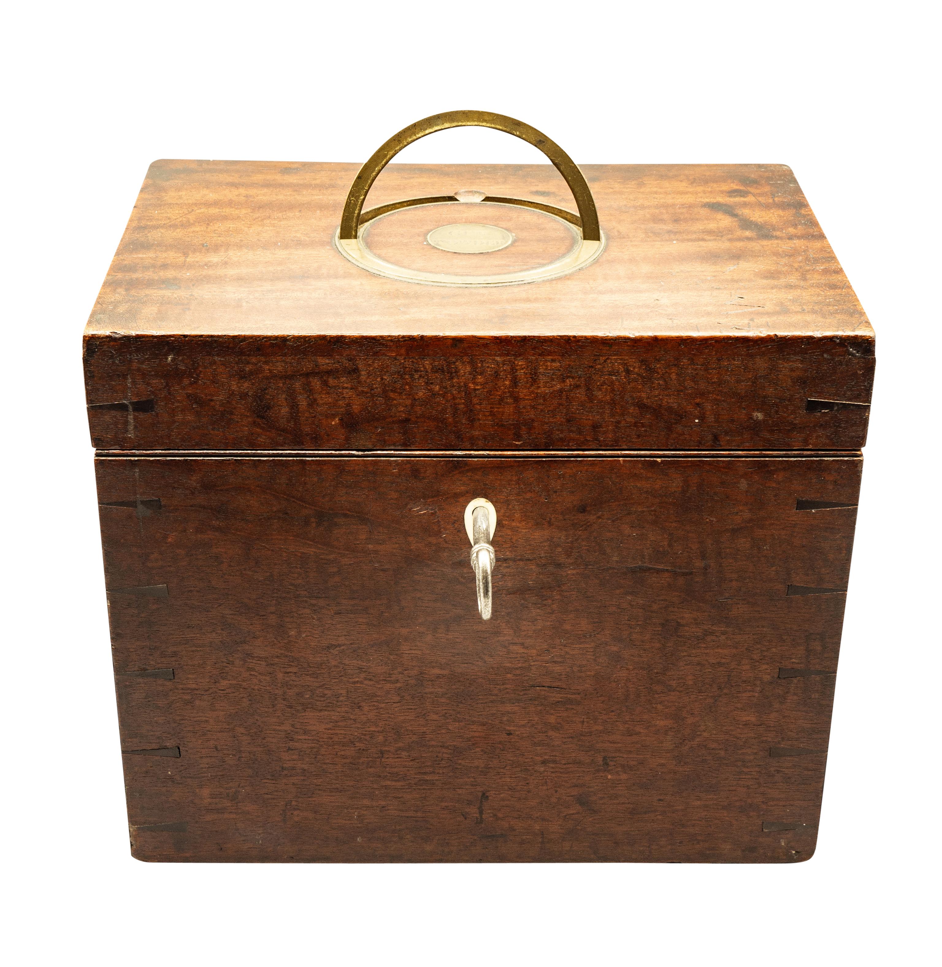Rectangular hinged lid with flush mounted brass handle marked 