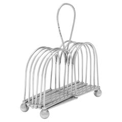 https://a.1stdibscdn.com/rare-george-iii-period-sterling-silver-extendable-toast-rack-sheffield-1807-for-sale/22569652/f_343156121684310468824/f_34315612_1684310469729_bg_processed.jpg?width=240