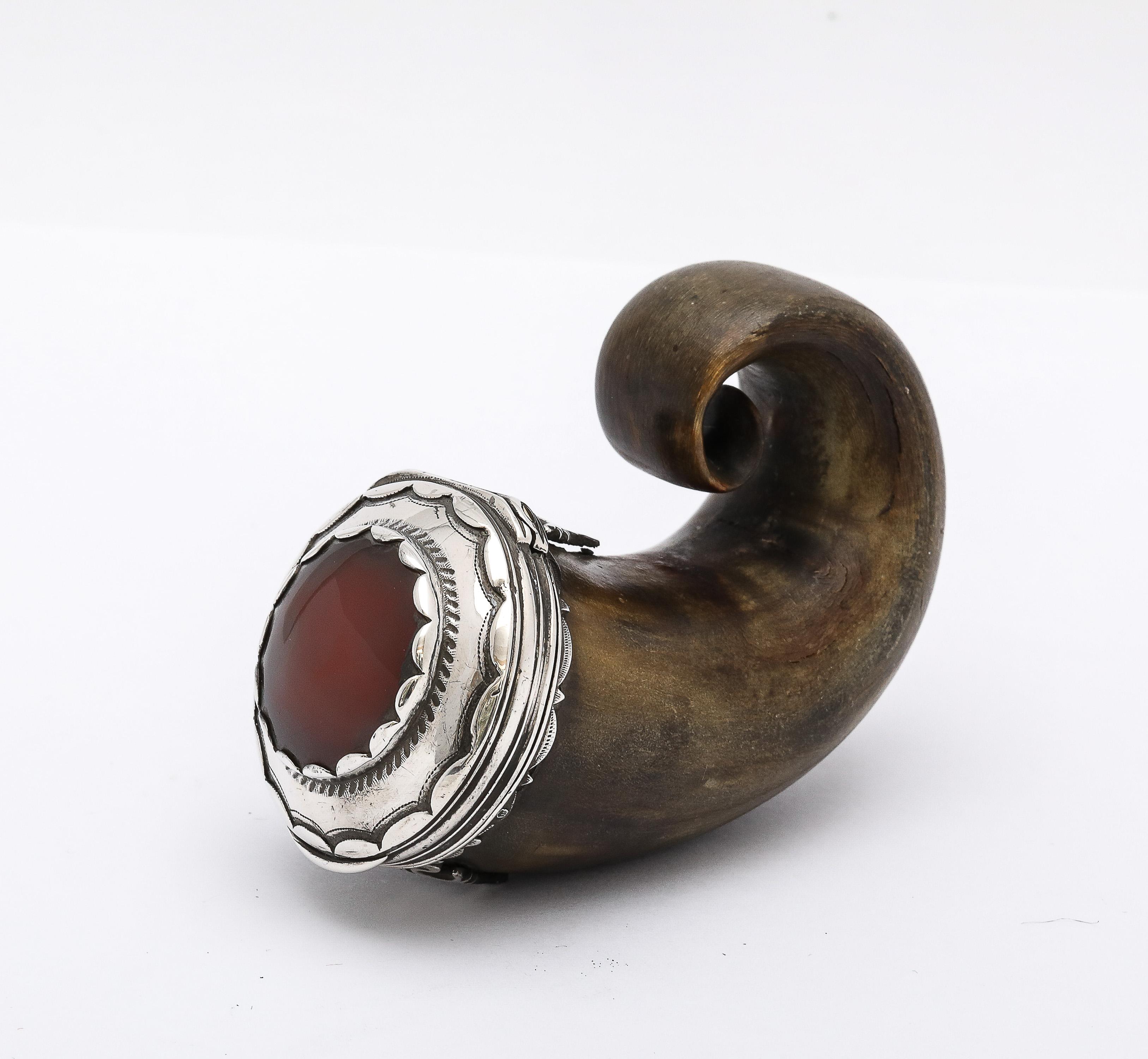 Unusual, rare, Georgian (George III) Period, sterling silver-mounted (unmarked, but tested) ram's horn snuff mull, having a hinged lid with a large carnelian stone central that hinged lid, Scotland, Ca. 1790-1810. Measures 2 3/4 inches high (when