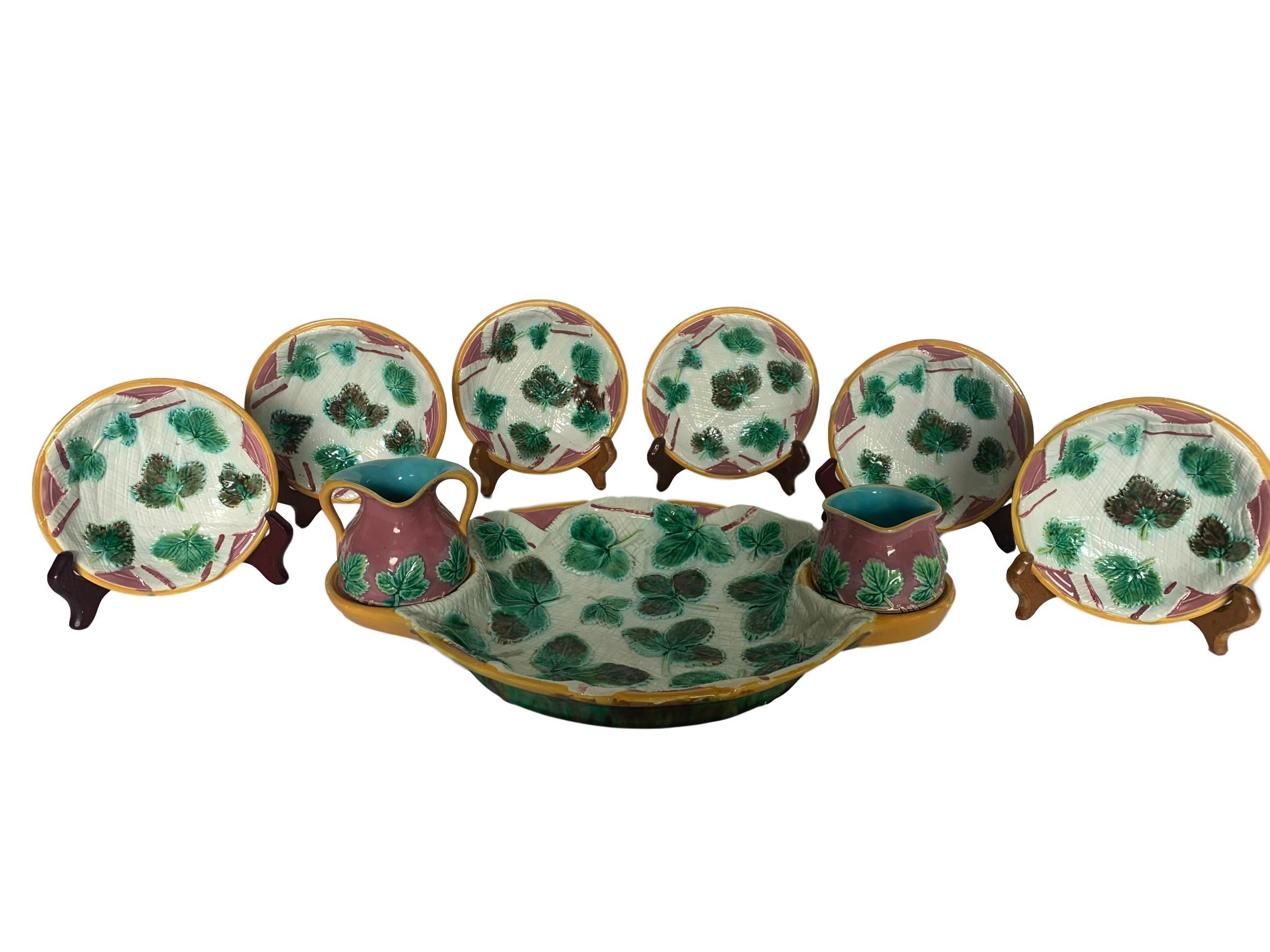 George Jones Majolica strawberry server 9-piece set consisting of strawberry server, creamer, sugar bowl and six berry bowls, English circa 1875. Great condition. Signed with cartouche stamp for George Jones & Sons, Stoke-upon-Trent.  Carteuse