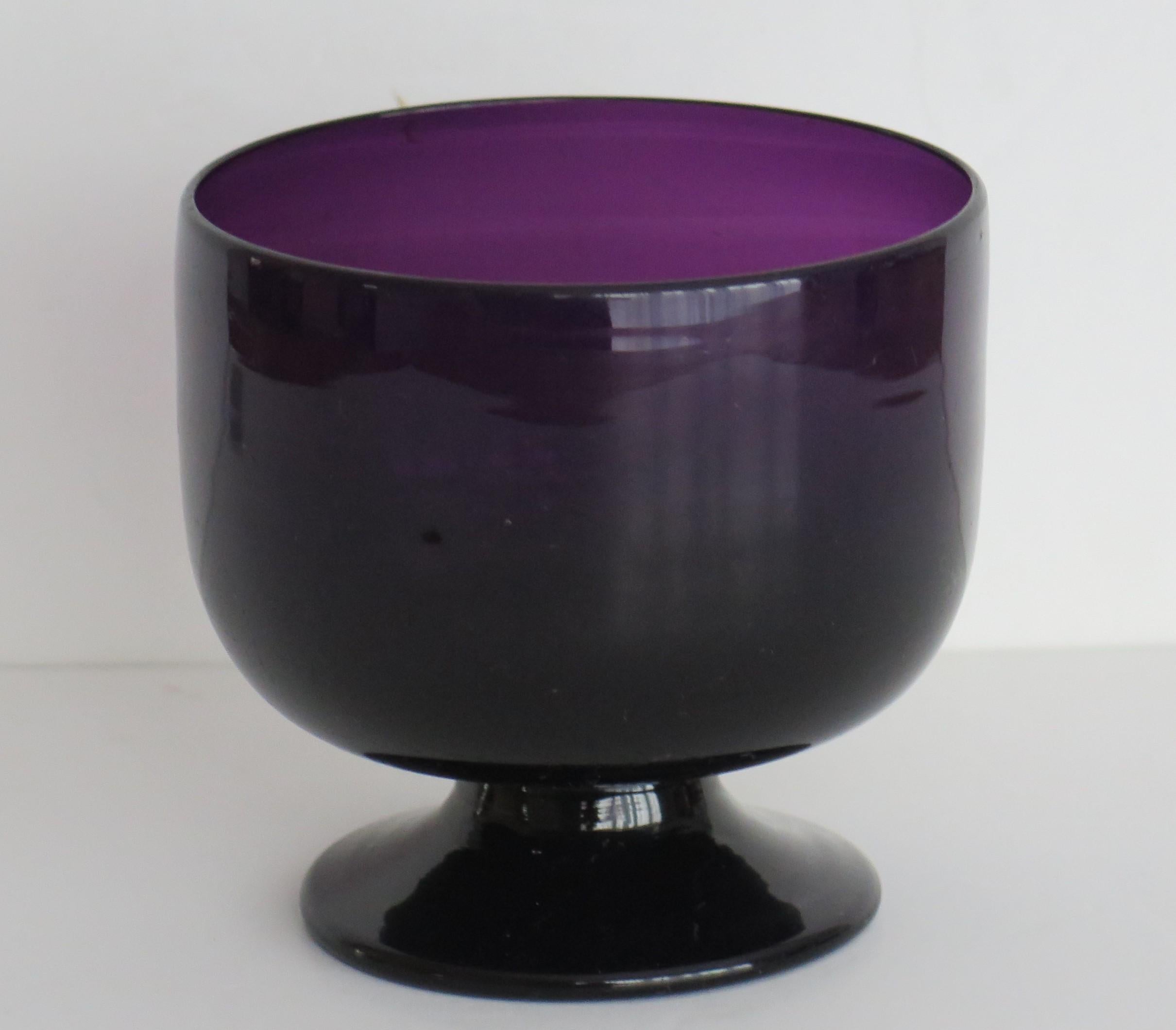 This is a rare hand blown lead glass sugar bowl in a beautiful amethyst colour, dating to the late 18th century, George 111rd period, circa 1800. 

The hand blown glass has a lovely amethyst colour which alters with the amount of light on
