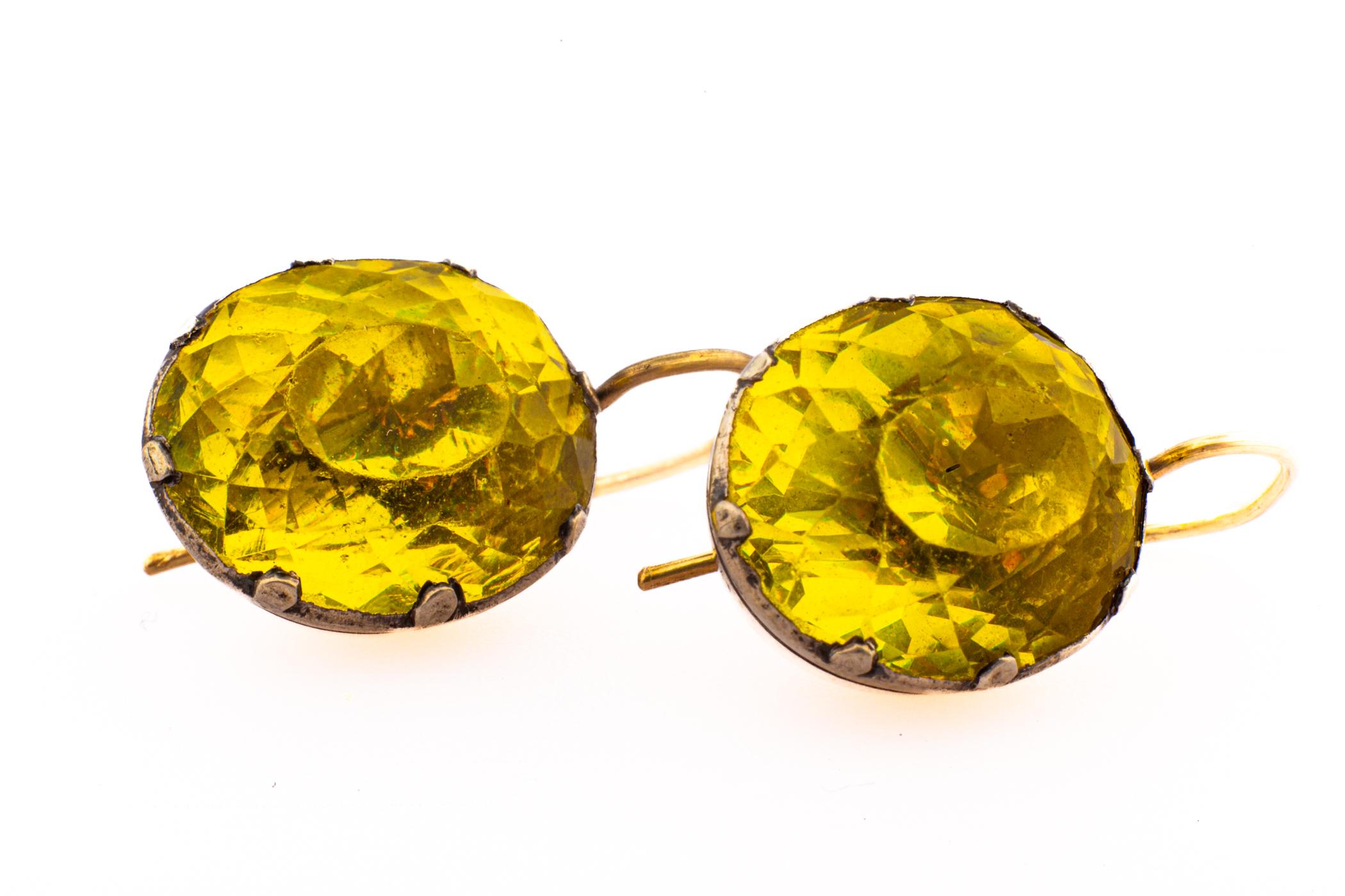 A startling and rare color of chartreuse and an unusually large carat size make these Georgian Paste Earrings exceptional. They are each approximately 6 cts in size. The color is almost neon. These are earrings to wear morning until evening,