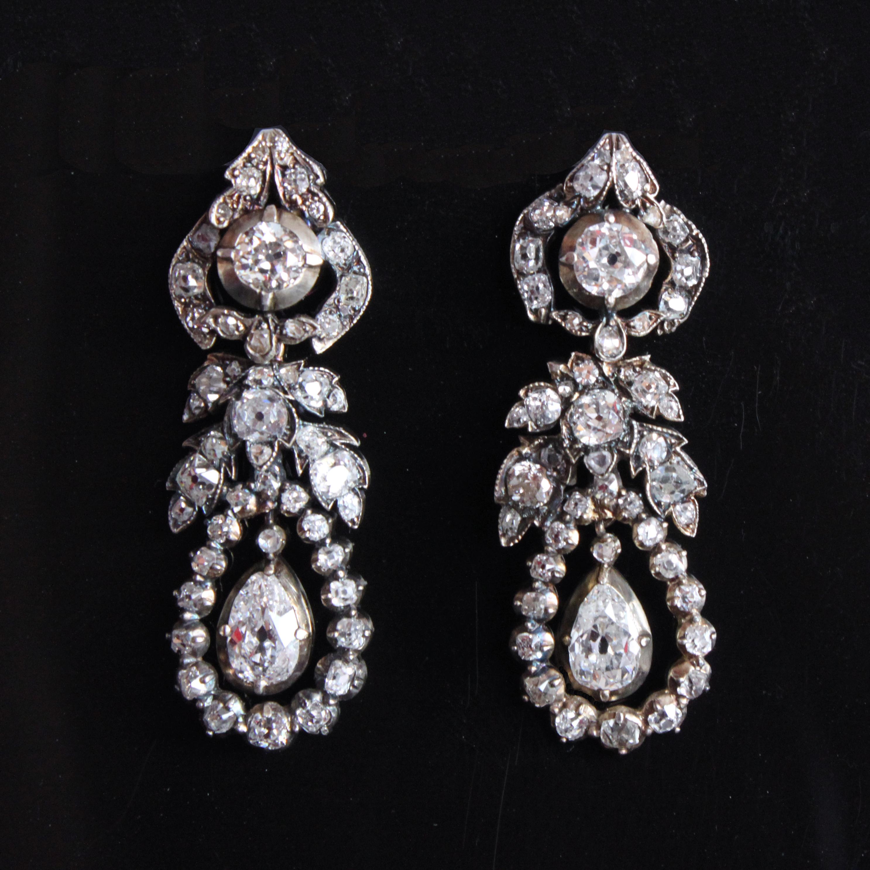 A beautiful and rare pair of Late Georgian Diamond Earrings, ca. 1810s

This rare pair of Georgian earrings is set with open work old-cut diamonds in a typical garland pendeloque style, suspending principal old-cut pear shaped diamonds of ca. 1.2