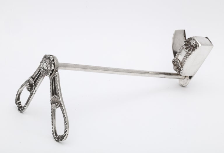 Unusual, rare pair of Georgian (George III), sterling silver, scissor-form candle wick snuffers, London, 1804, Thomas Robinson - maker. Decorated with shells and a Tudor Rose. The snuffer works like a pair of scissors to snuff out a flame and cut