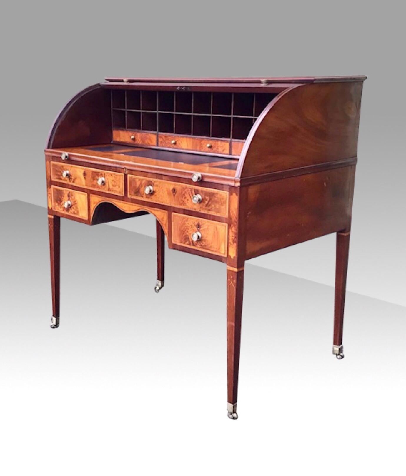 circa 1780 - 1790
We are delighted to have for sale this very rare George III Hepplewhite period inlaid mahogany tambour estate writing desk. 
The secretaire is fully fitted with lettered pigeon holes and choice mahogany,ebony strung fruitwood