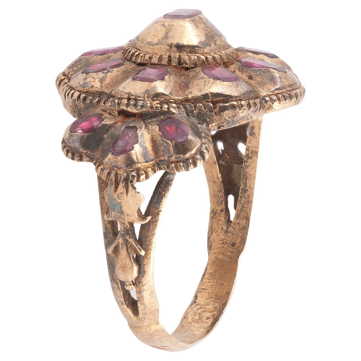 Late-1700s (Georgian era) Italian gold ring with table cut rubies in closed setting. This beautiful example is completely original, it features a lovely flower bow shape with decorated 