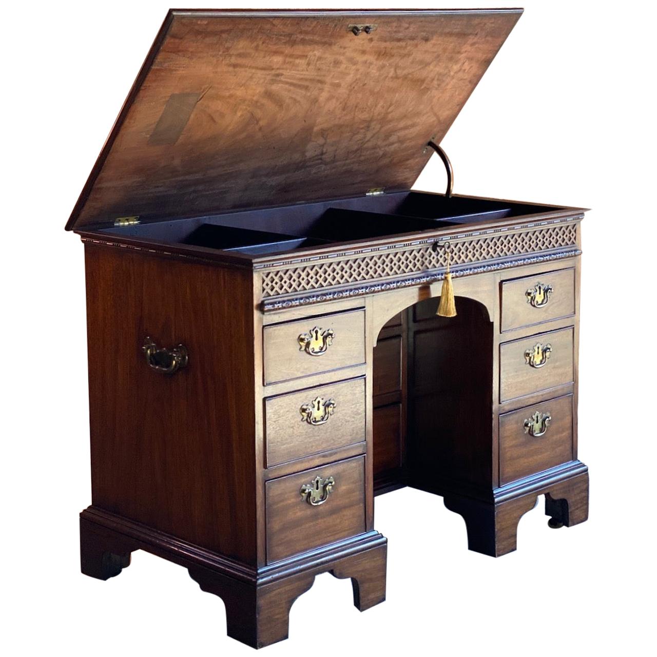 Rare Georgian mahogany kneehole desk lift up top, 18th century, circa 1780

A rare 18th century George III mahogany gentleman's kneehole desk, England, circa 1780, the lockable hinged lift up top enclosing an arrangement of compartments, above a