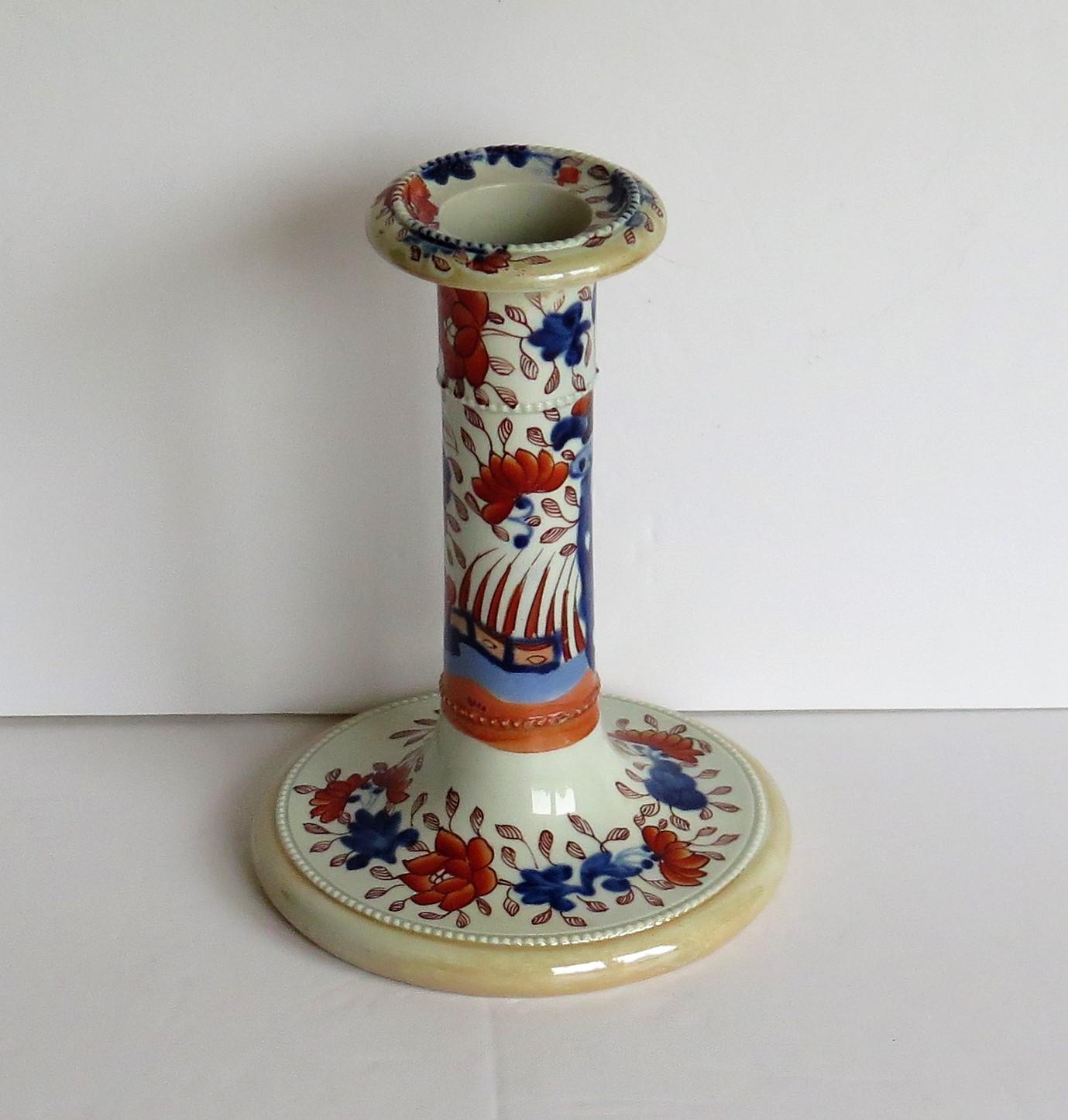 This is a rare and decorative Ironstone pottery candlestick, hand painted in the Fence Japan pattern and made by the Mason's factory at Lane Delph, Staffordshire, England, circa 1820.

Mason's ironstone Candlesticks are rare items.

The candlestick