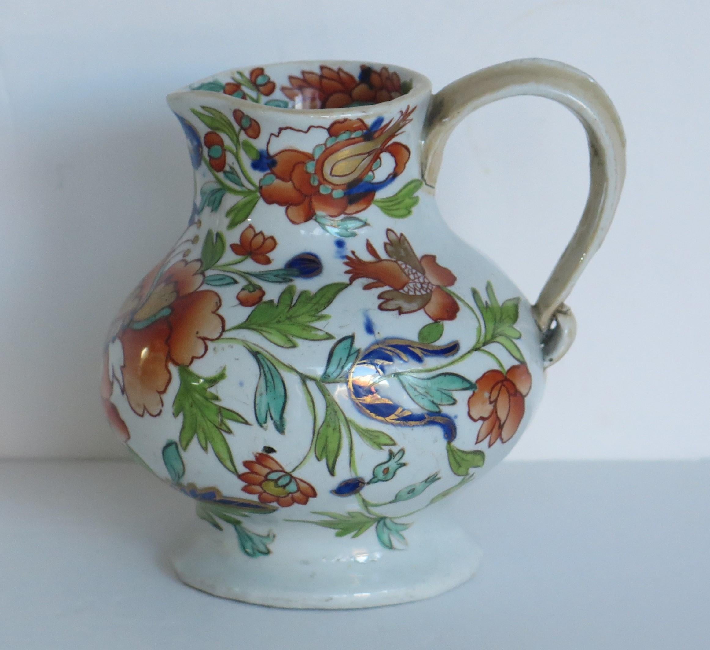This is a rare very early Cream Jug in a rare shape, hand painted in the large stamen flower pattern, made by Mason's Ironstone, Lane Delph, England and dating to circa 1813-1820.

The pattern is hand painted with typical bold free flowing enamels