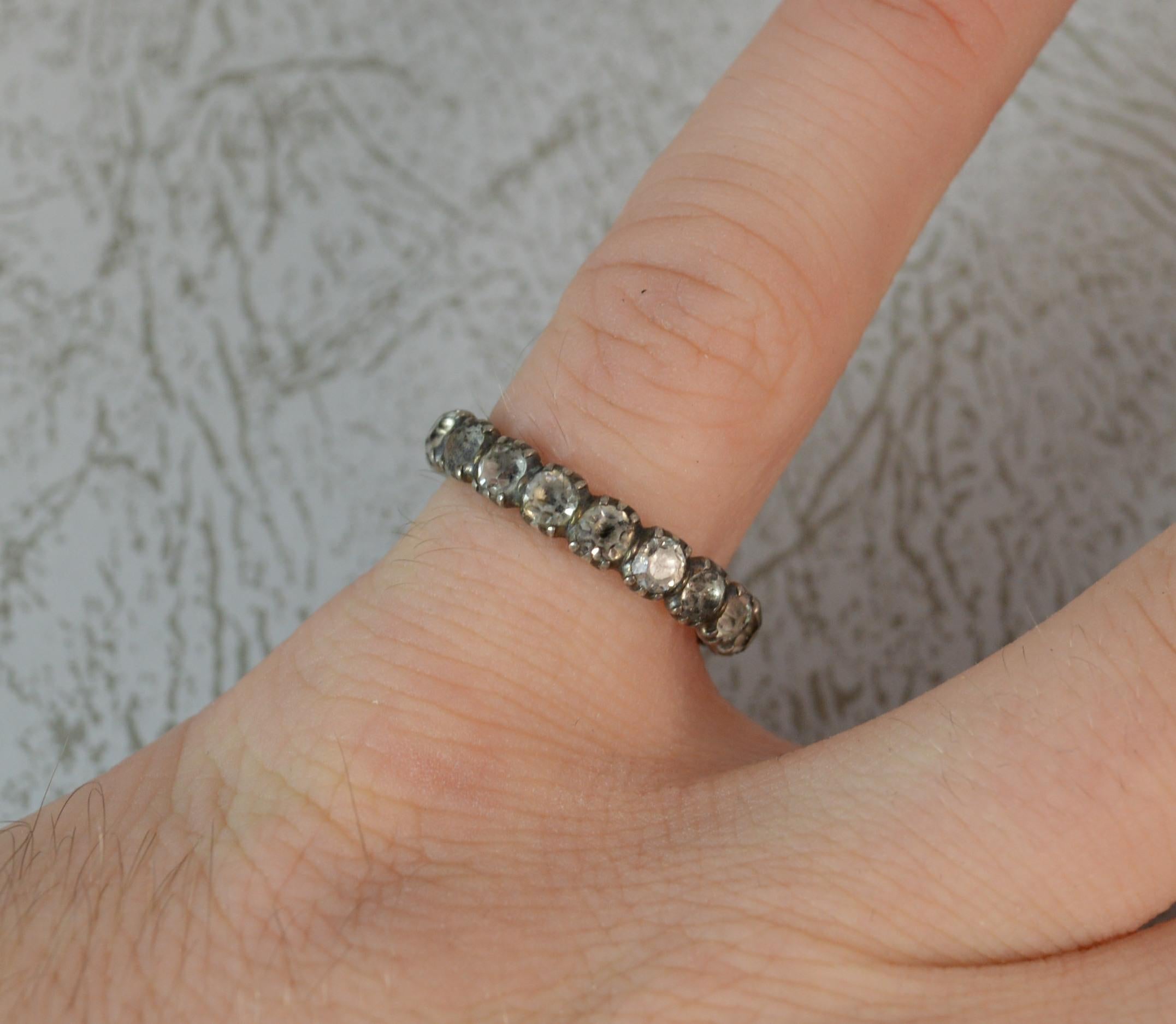 SIZE ; L UK, 5 3/4 US
A very rare and genuine Georgian II or III period stack band ring. Solid gold example. Set with white foiled back paste stones to form a full eternity. 3.7mm wide band approx. c1760.

CONDITION ; Good for age. Crisp pattern.