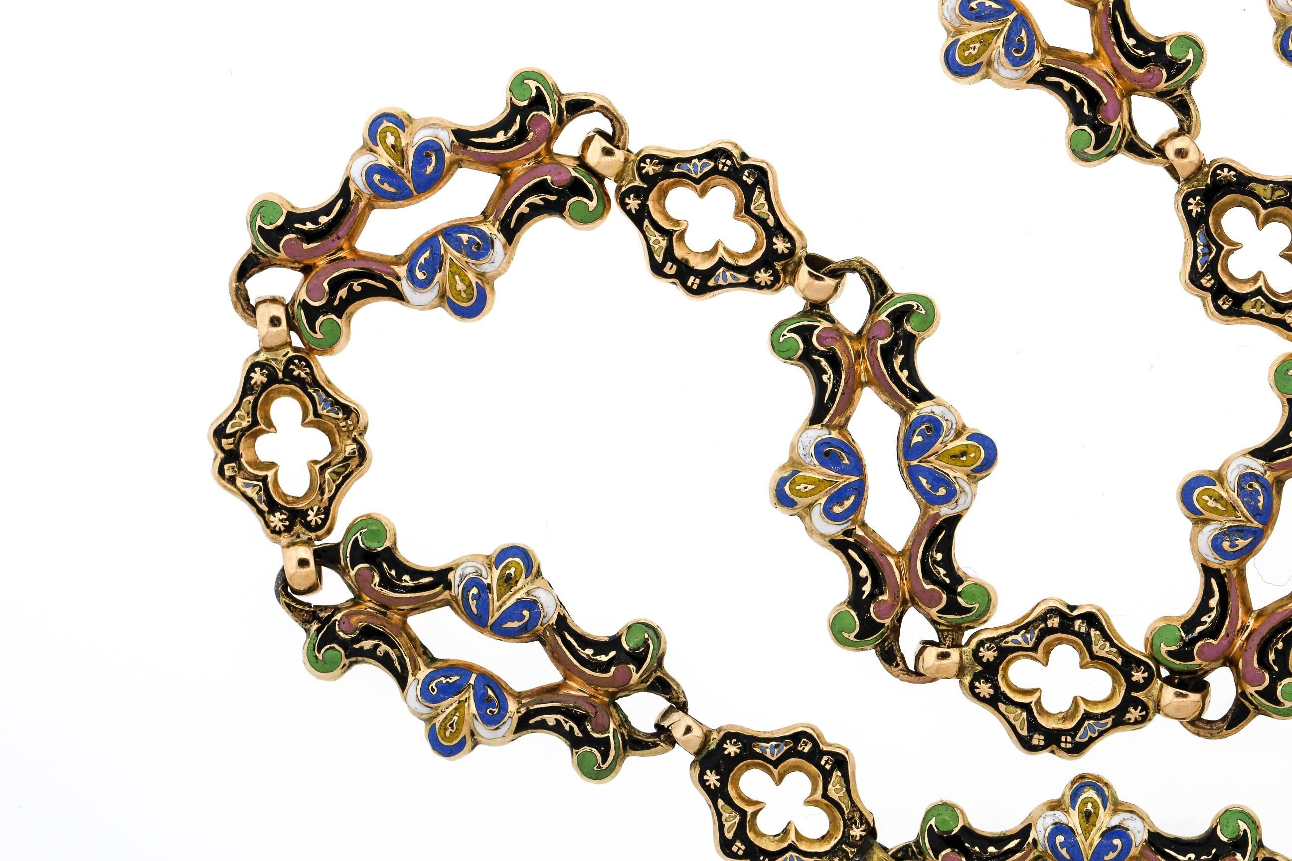 This is a stunning example of a Swiss Enamel long chain. Likely made around 1830, this 18k chain features large and small scalloped links that are enamel with the most gorgeous colors. Light blue and pink and green is accented by black and gold. The