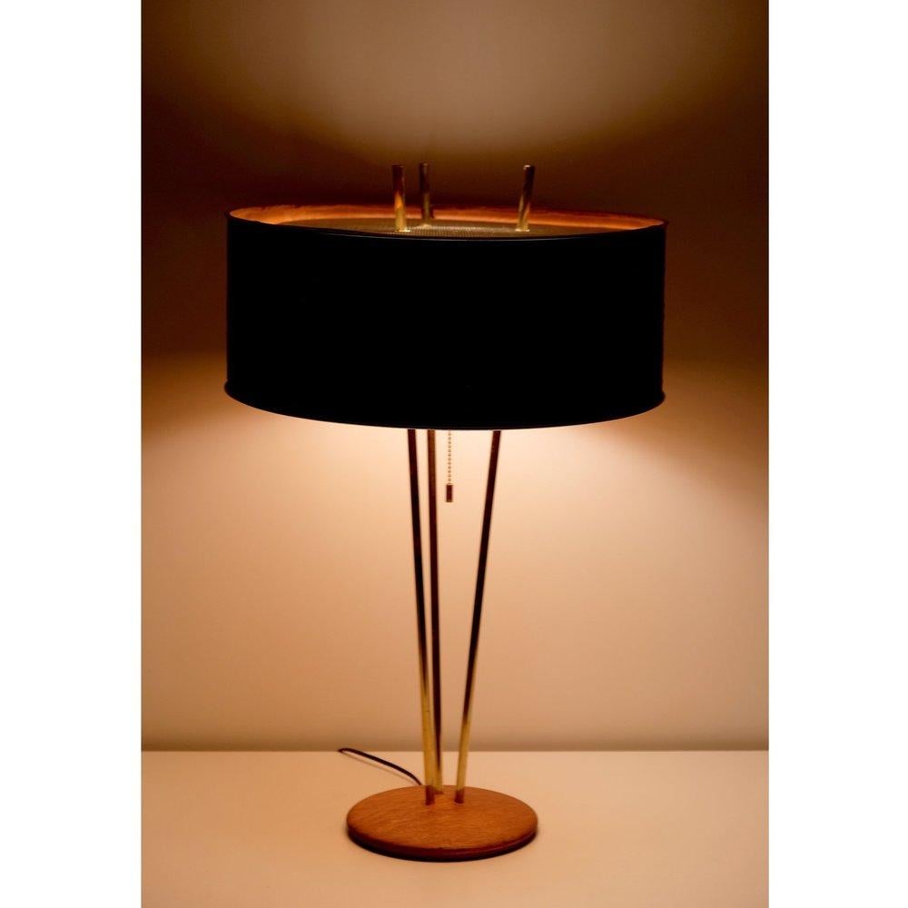 Rare Gerald Thurston table lamp for Lightolier. Polished brass stems on walnut base. Original grass cloth shade, lacquered steel diffuser. 3 x 40 watts E-26 Edison medium base incandescent bulb recommended or higher if LED/CFL.

Shade has a few
