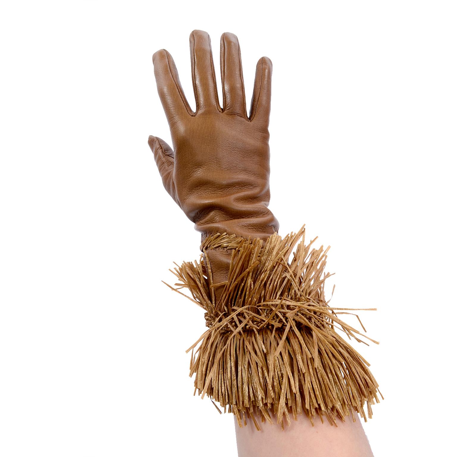 From our favorite blouse designer, Gianfranco Ferre is also a master of accessories!  We have always loved his gloves and this particular pair is exceptional!  These vintage buttery soft tan leather gloves have braided straw on the top of the left