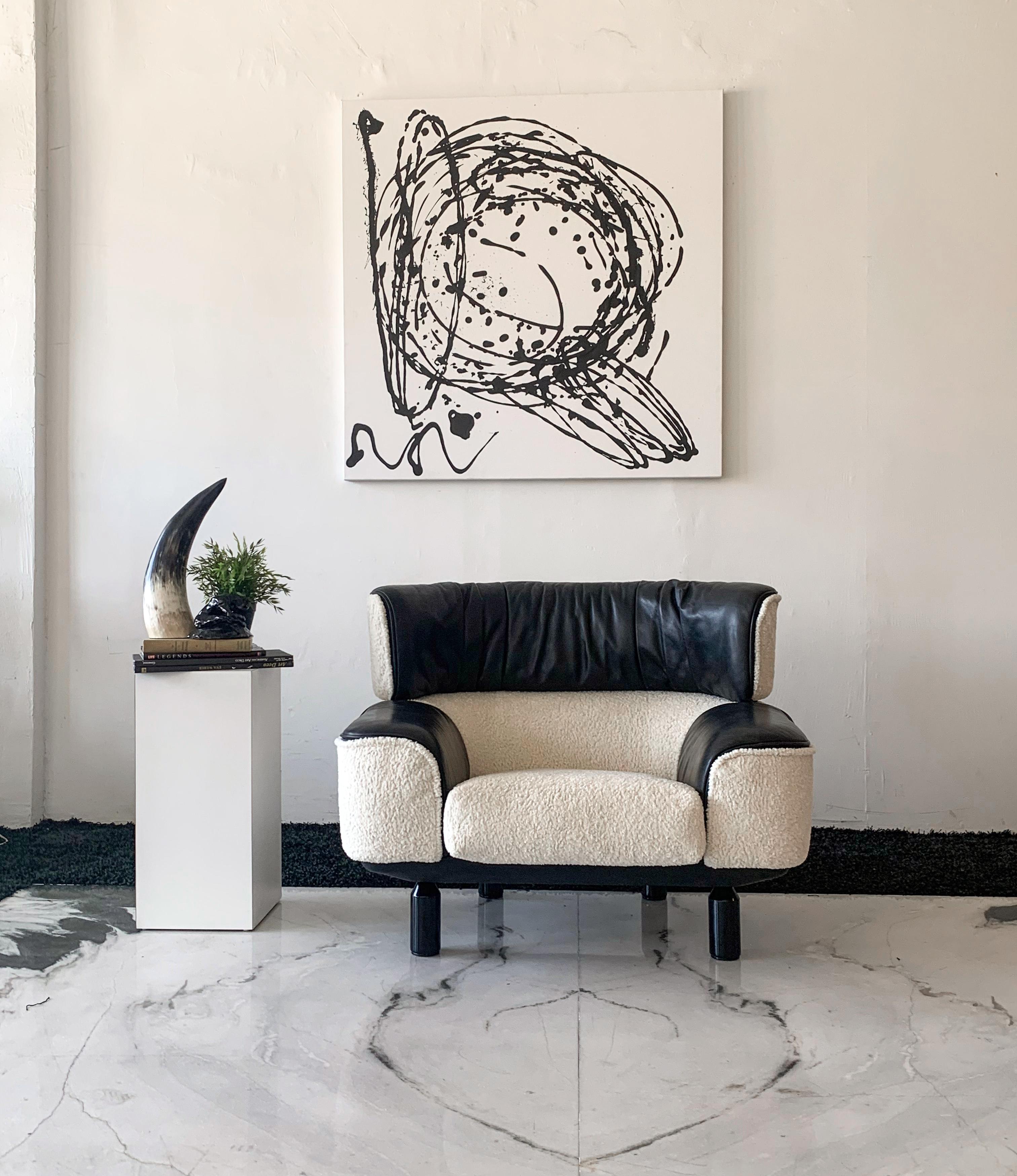 This Gianfranco Frattini Cassina Bull lounge chair is absolutely stunning. This piece was designed back in 1987 during the start of the Postmodern / Memphis Milano movement. This chair was and still is a piece of trendsetting design to this