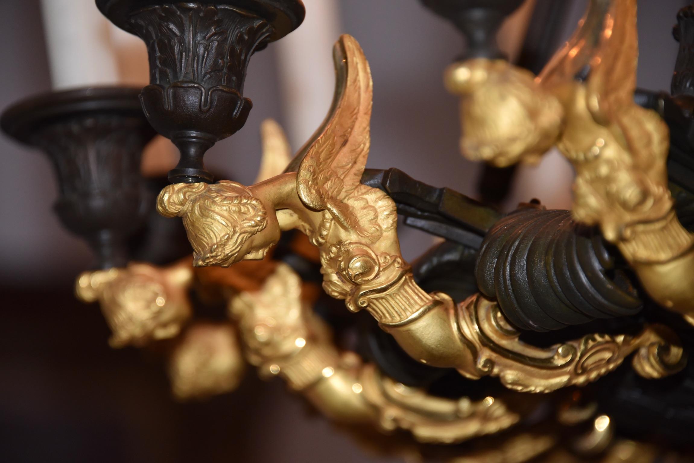 Very high quality chandelier in carved, gilt bronze and patina dark. 18-light arms decorated with beautiful winged ladies. Attributed to Claude Galle!
Dimension: 1.20 x 90 cm.