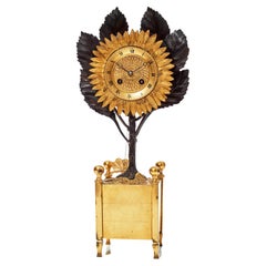Raro reloj de chimenea con girasol de bronce dorado del Imperio francés Charles X