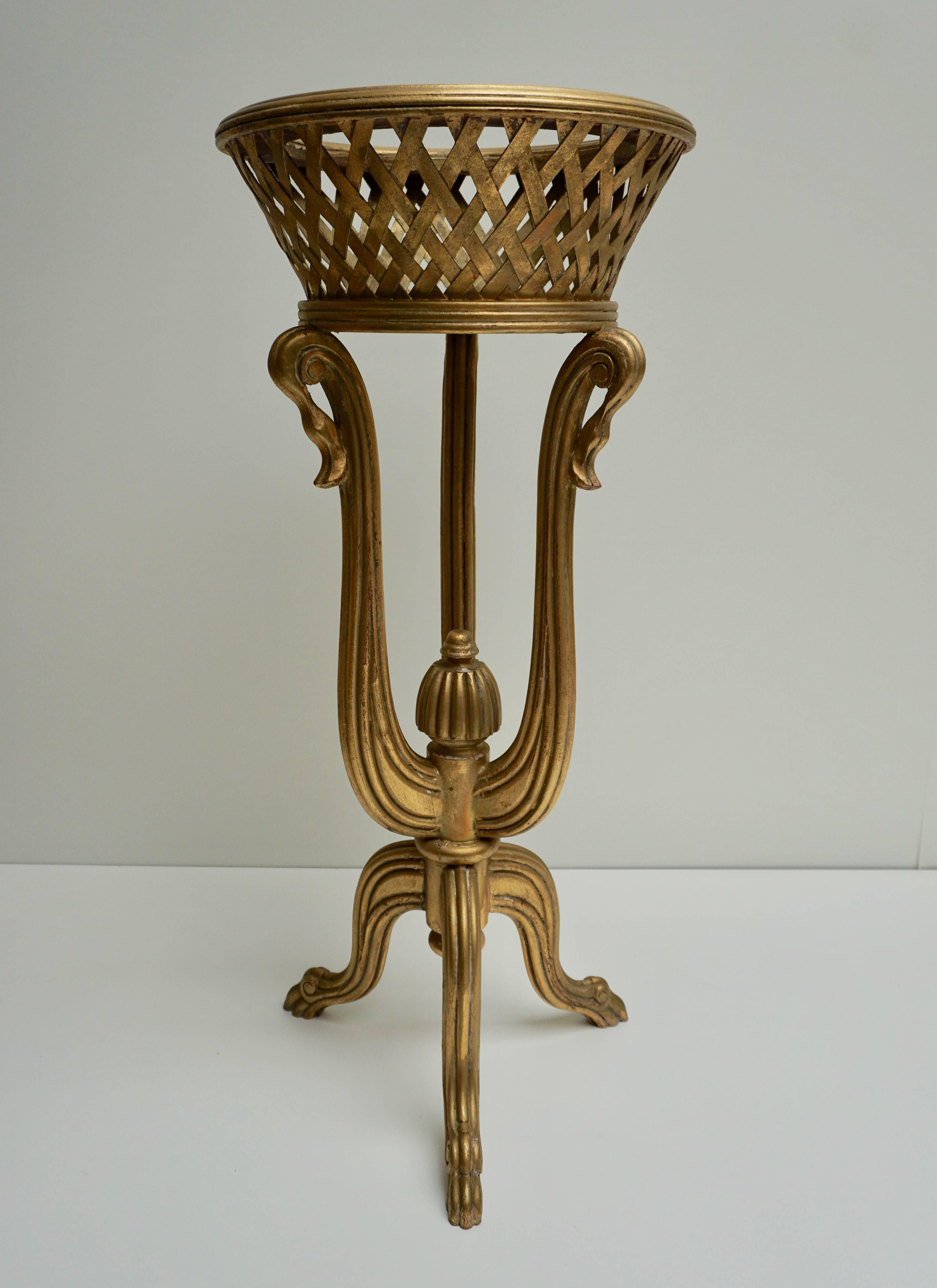 A rare and elegant tripod giltwood flower basket in the Art Deco style of Edgar Brandt, circa 1930.
Measures: Height 93 cm.
Diameter 40 cm.
