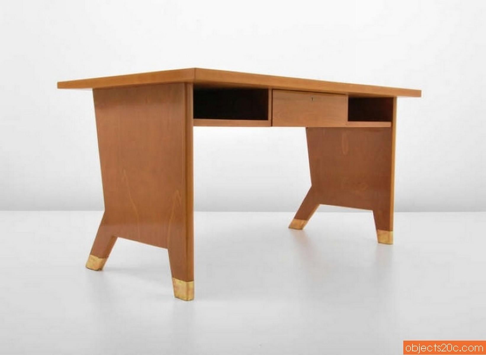 Artist/Designer: Gio Ponti (Italian, 1891-1979)

Additional Information: Desk has splayed front legs, a single drawer, open storage areas and brass sabots. It also has a matching wall shelf. Desk/shelf has a certificate of expertise from the Gio