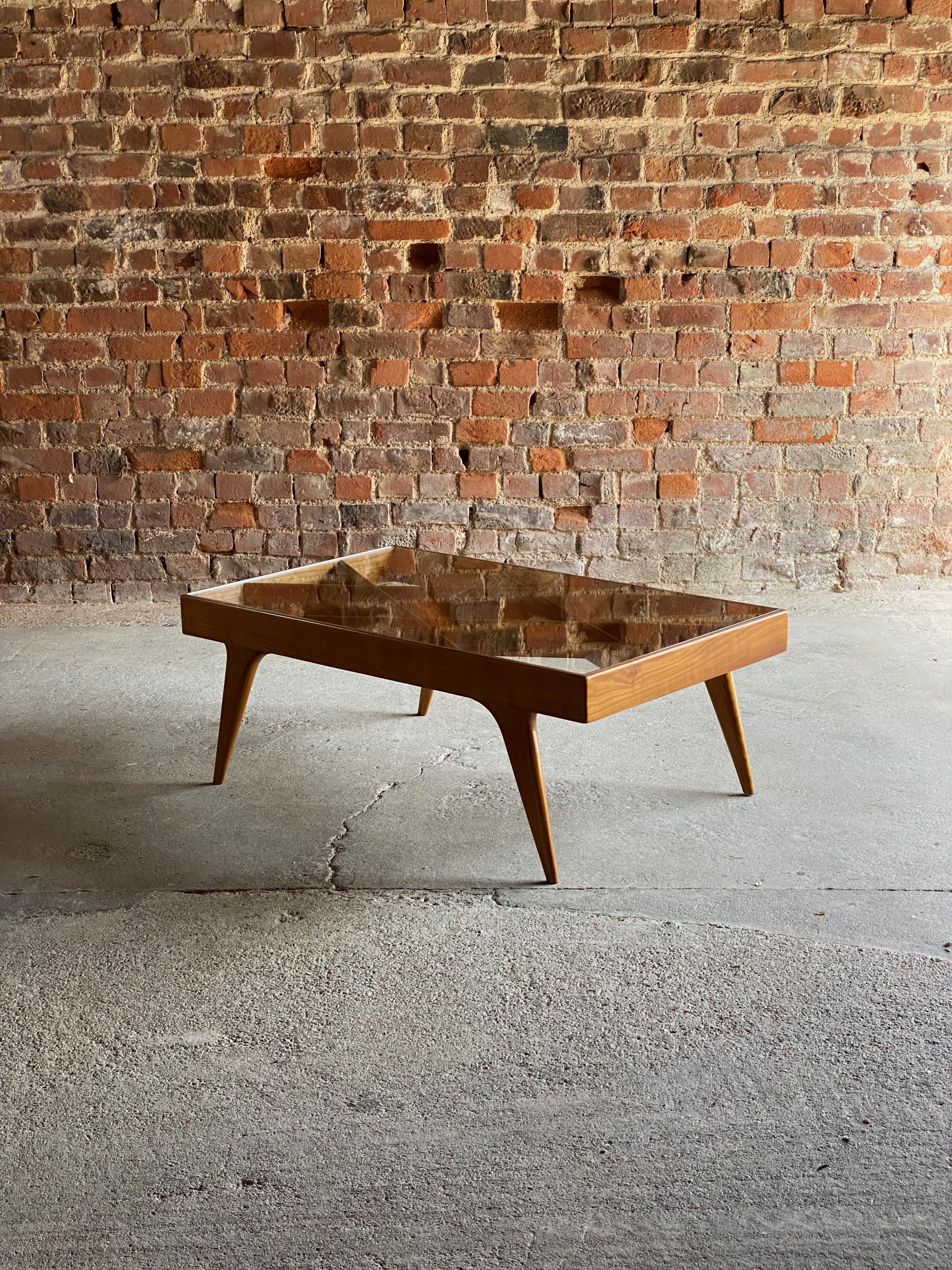 Magnificent mid century walnut & glass coffee table Italy 1950.

Rare and important Lattice Walnut & Glass Coffee Table Milan, Italy Circa 1950, the rectangular glass top with lattice framework over outward swept tapered legs, manufactured by