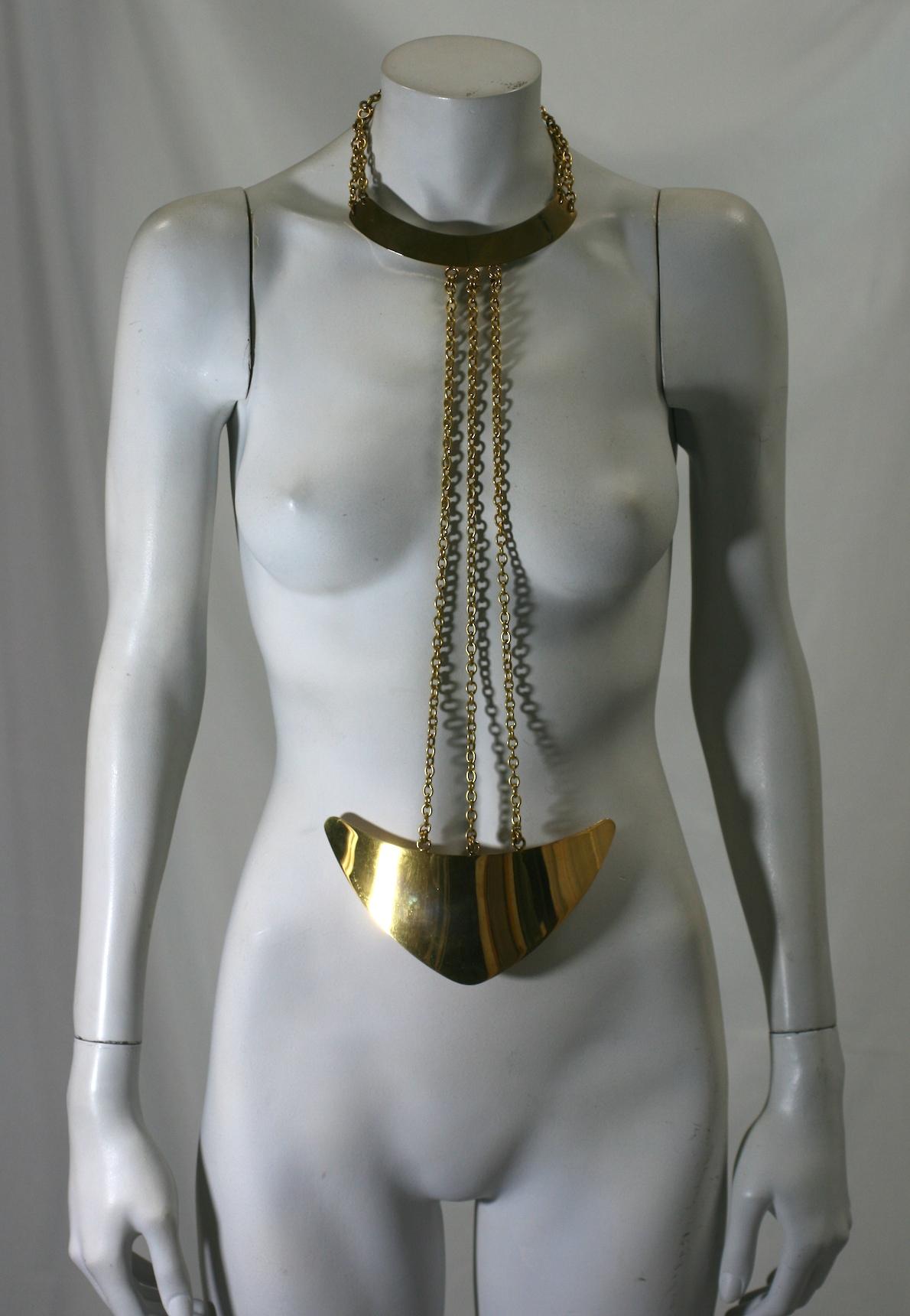 Rare Givenchy Body Jewel of gilt bronze from the 1960's. Designed surely to showcase a simple turtleneck mini in solid tones. This massive and rare design shows Givenchy responding to the 