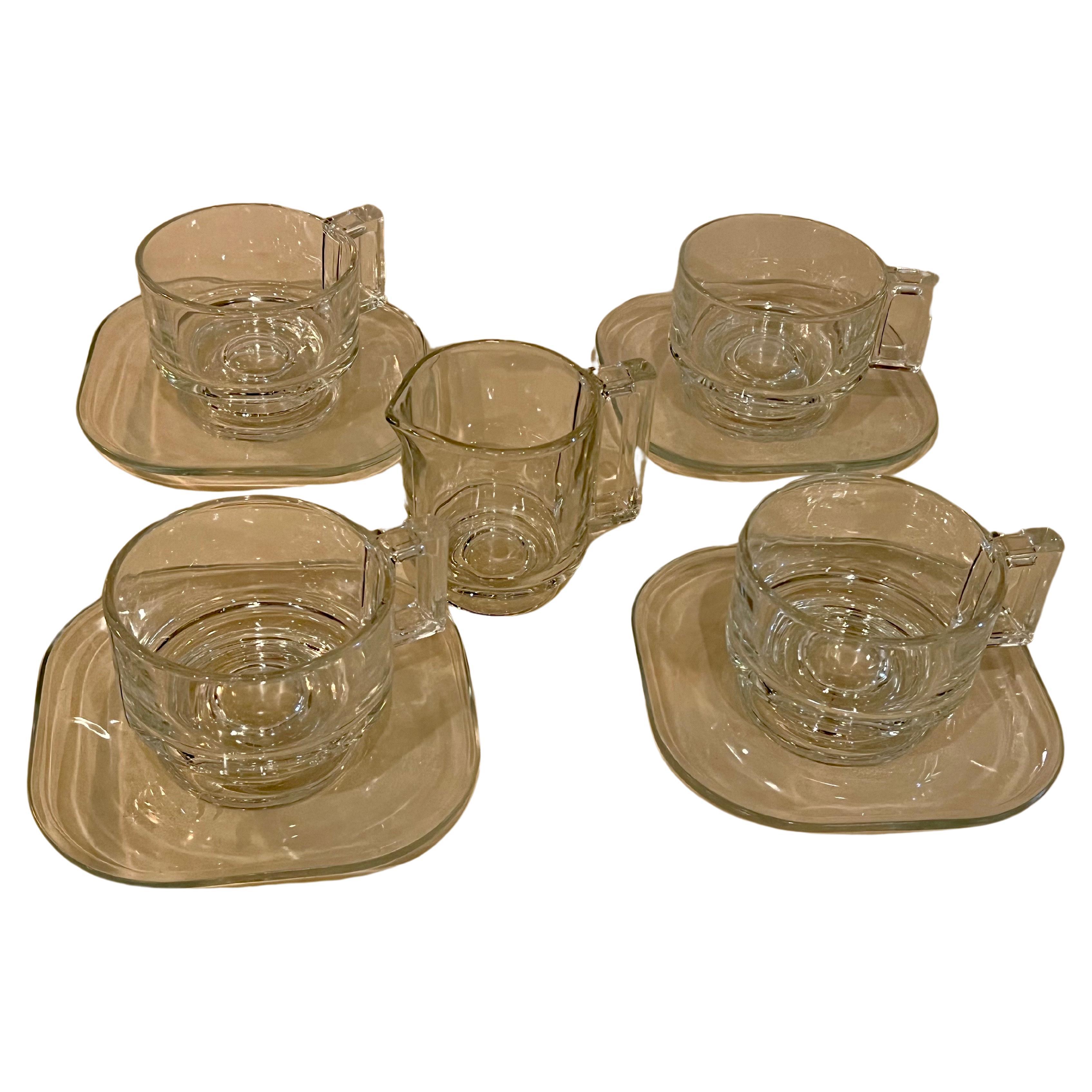 https://a.1stdibscdn.com/rare-glass-coffee-tea-set-with-creamer-plate-by-joe-colombo-for-arno-for-sale/f_9366/f_362987421695501336317/f_36298742_1695501337911_bg_processed.jpg